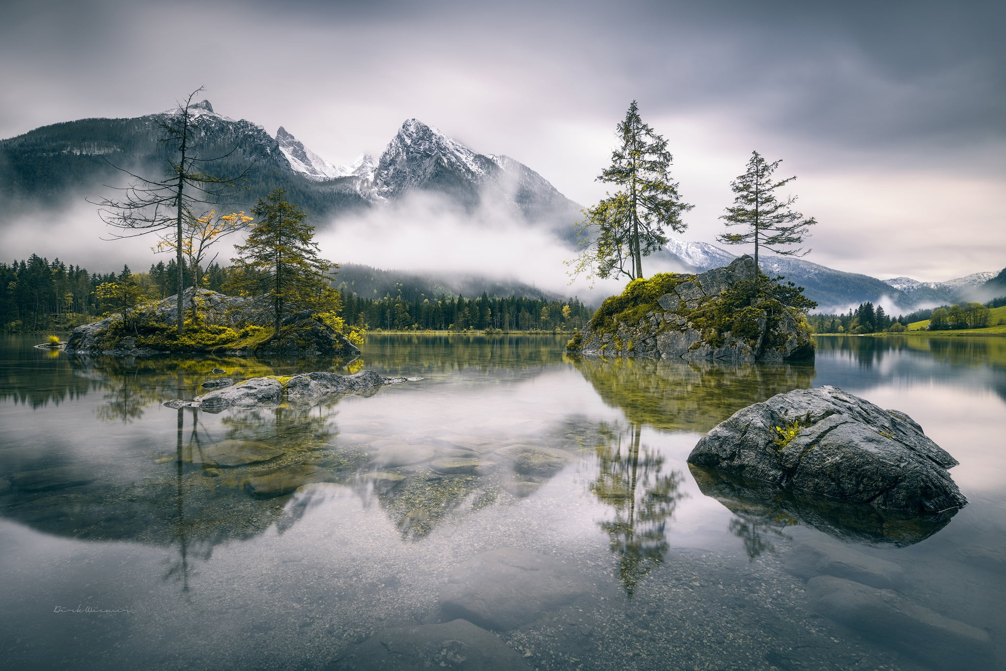 landscape photography of lake near foggy mountain, mountains