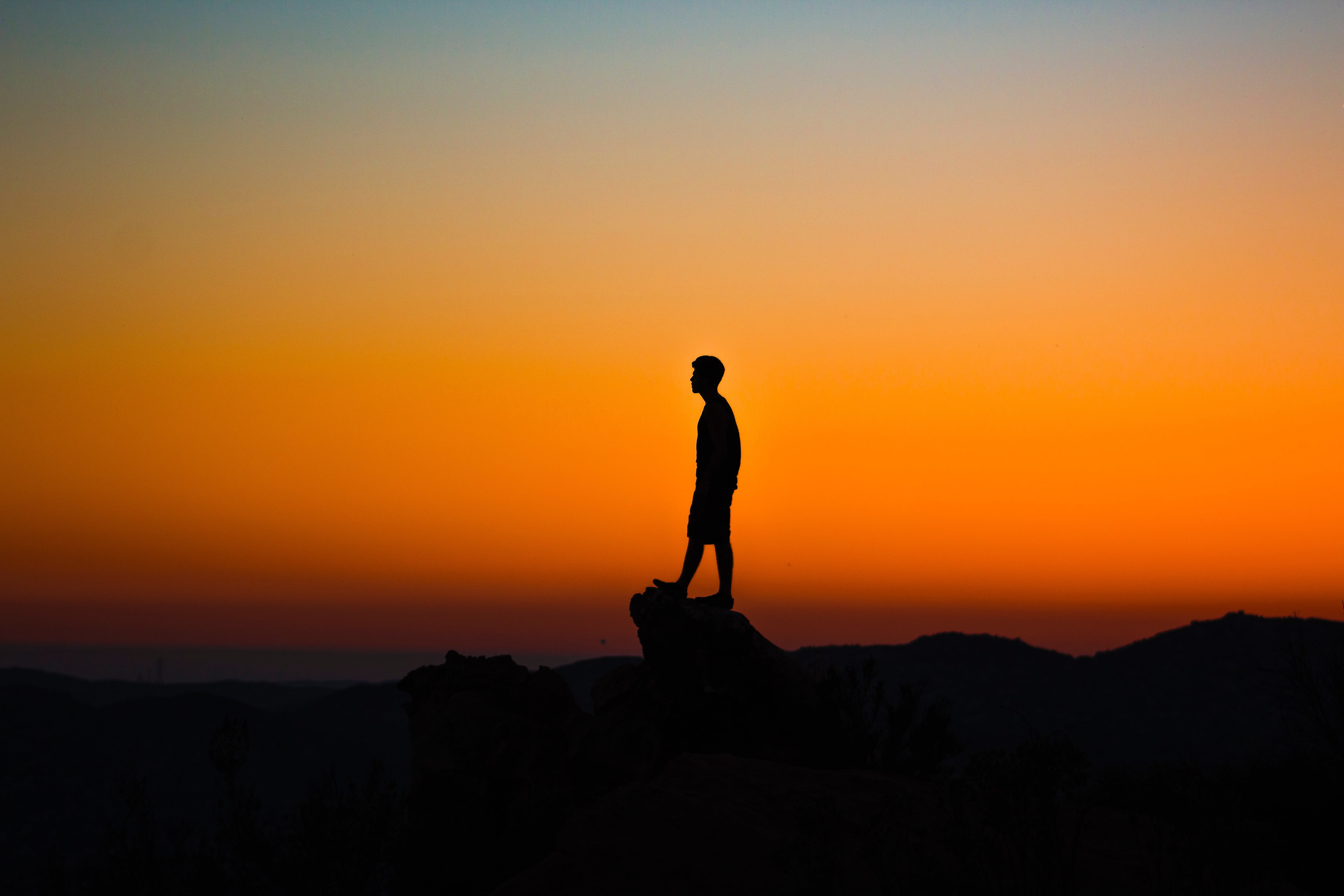 man on cliff silhouette photo, sky, sunset, outdoors, nature