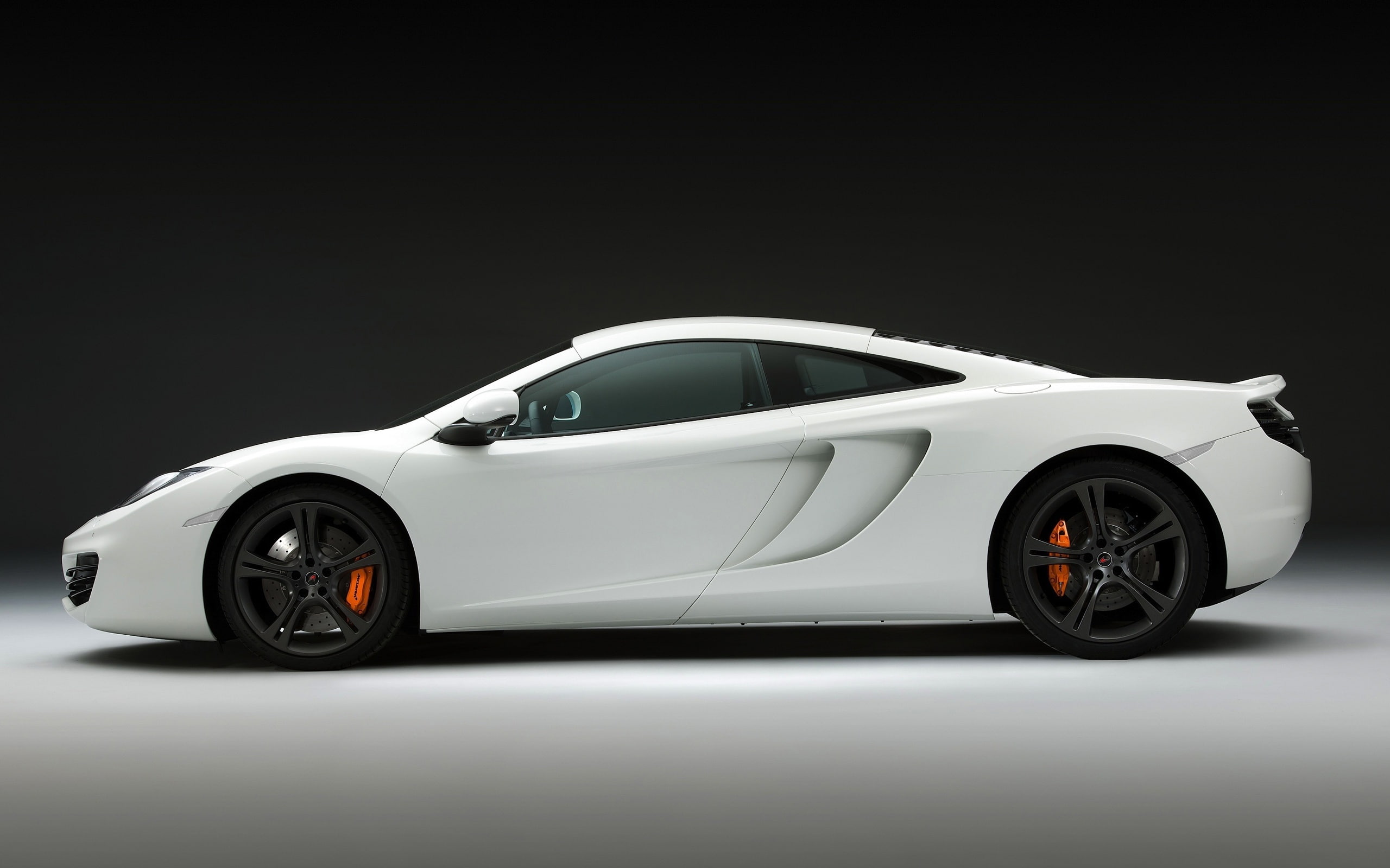 McLaren MP4-12C white supercar, side close-up, white and black coupe