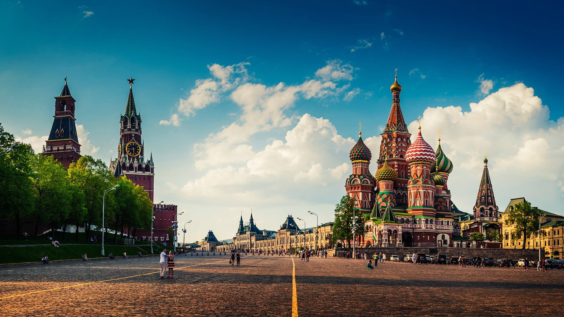 cityscape architecture city building urban moscow russia kremlin town square cathedral old building people street trees clouds clock towers red square pavers capital