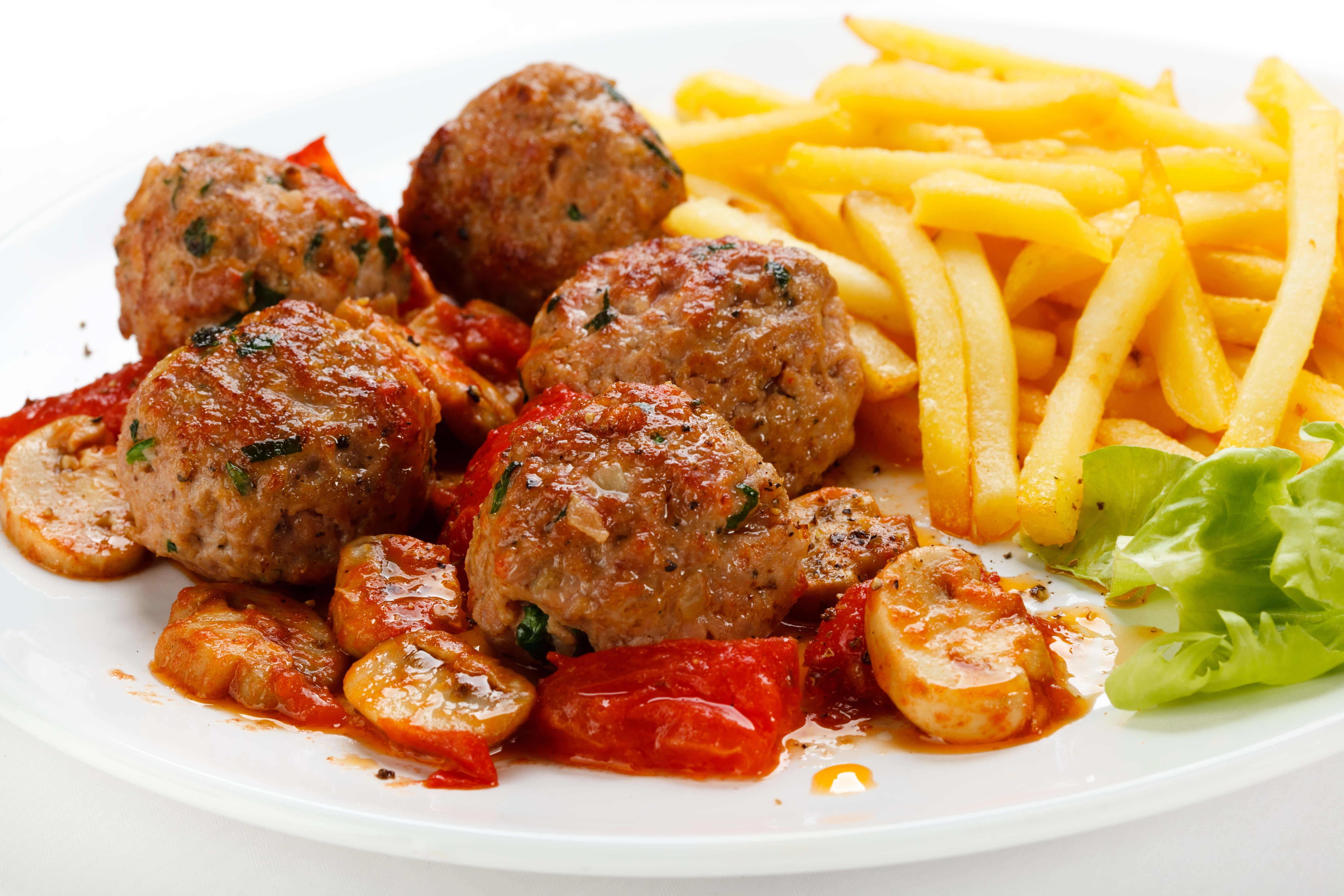 meatballs with fries, potatoes, mushrooms, plate, white background