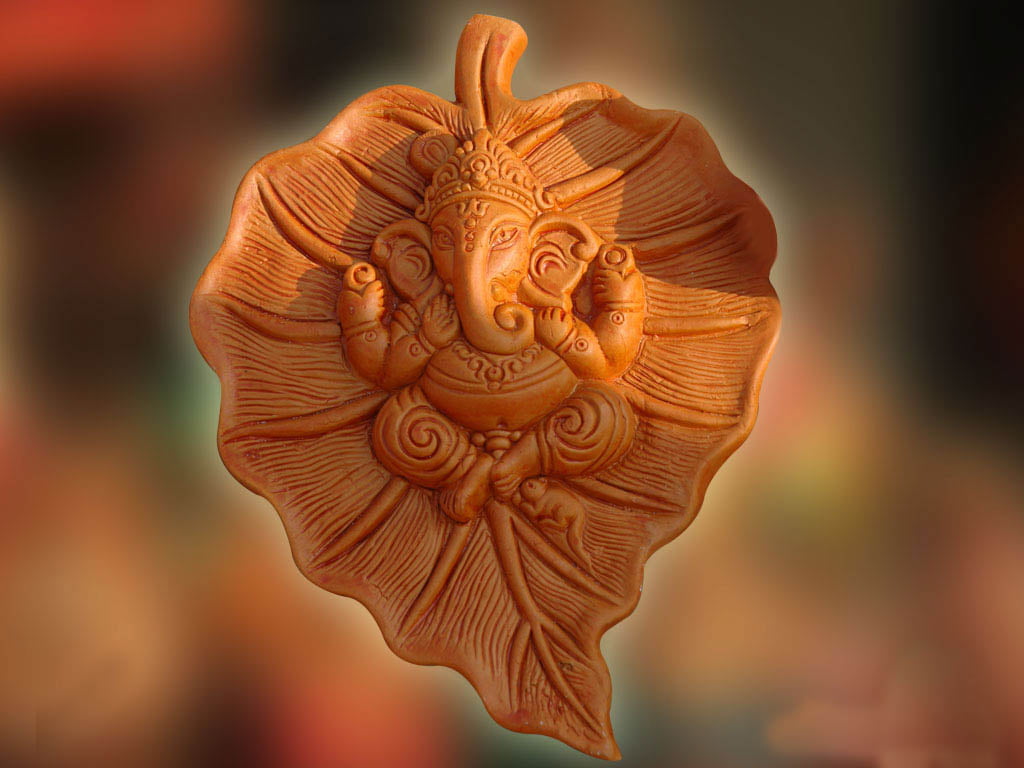 Beautiful Lord Ganesha On Leaf, brown ceramic Lord Ganesha embossed leafed decor