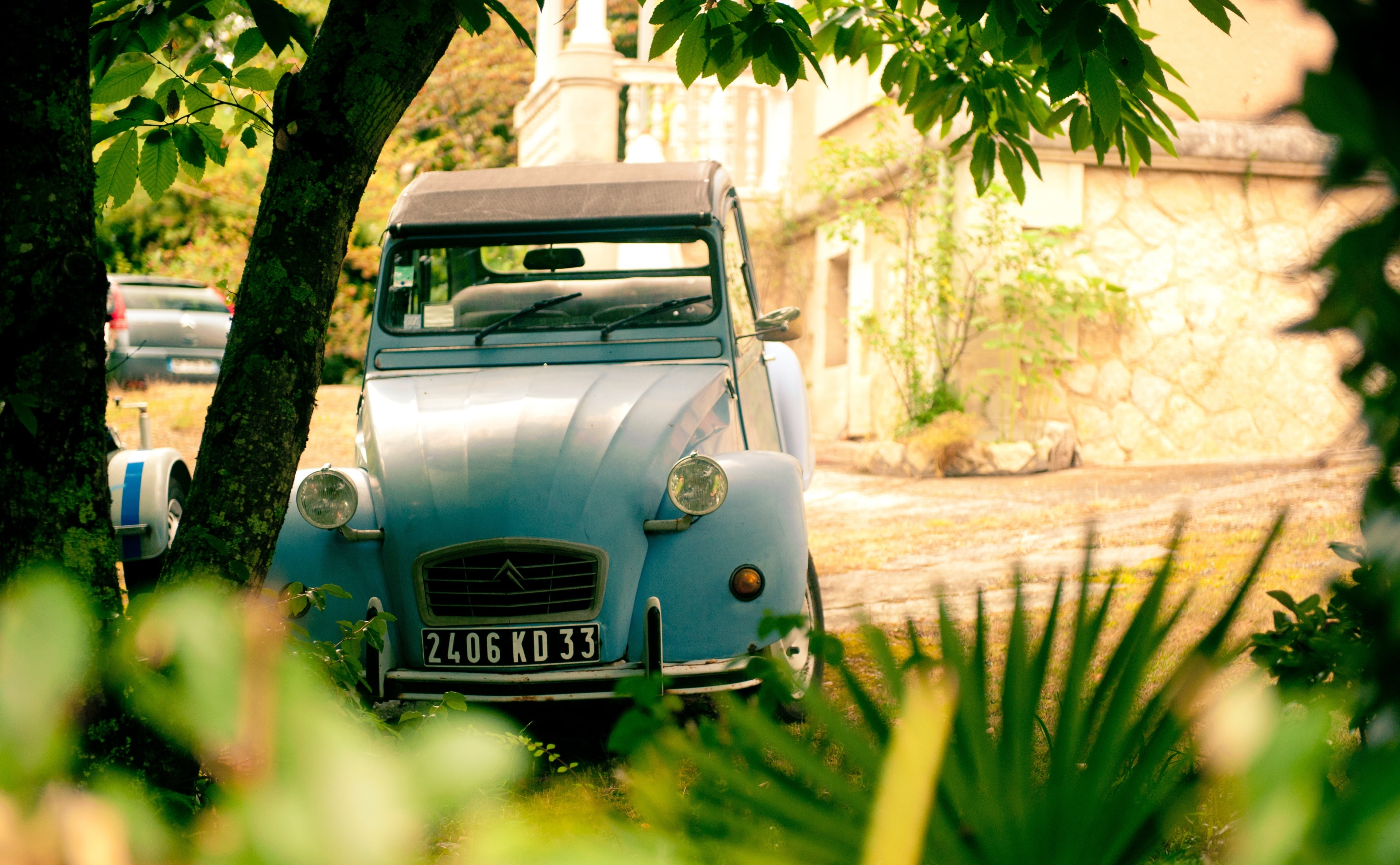 Citroen 2CV   Arcachon, France, classic blue and brown convertible coupe