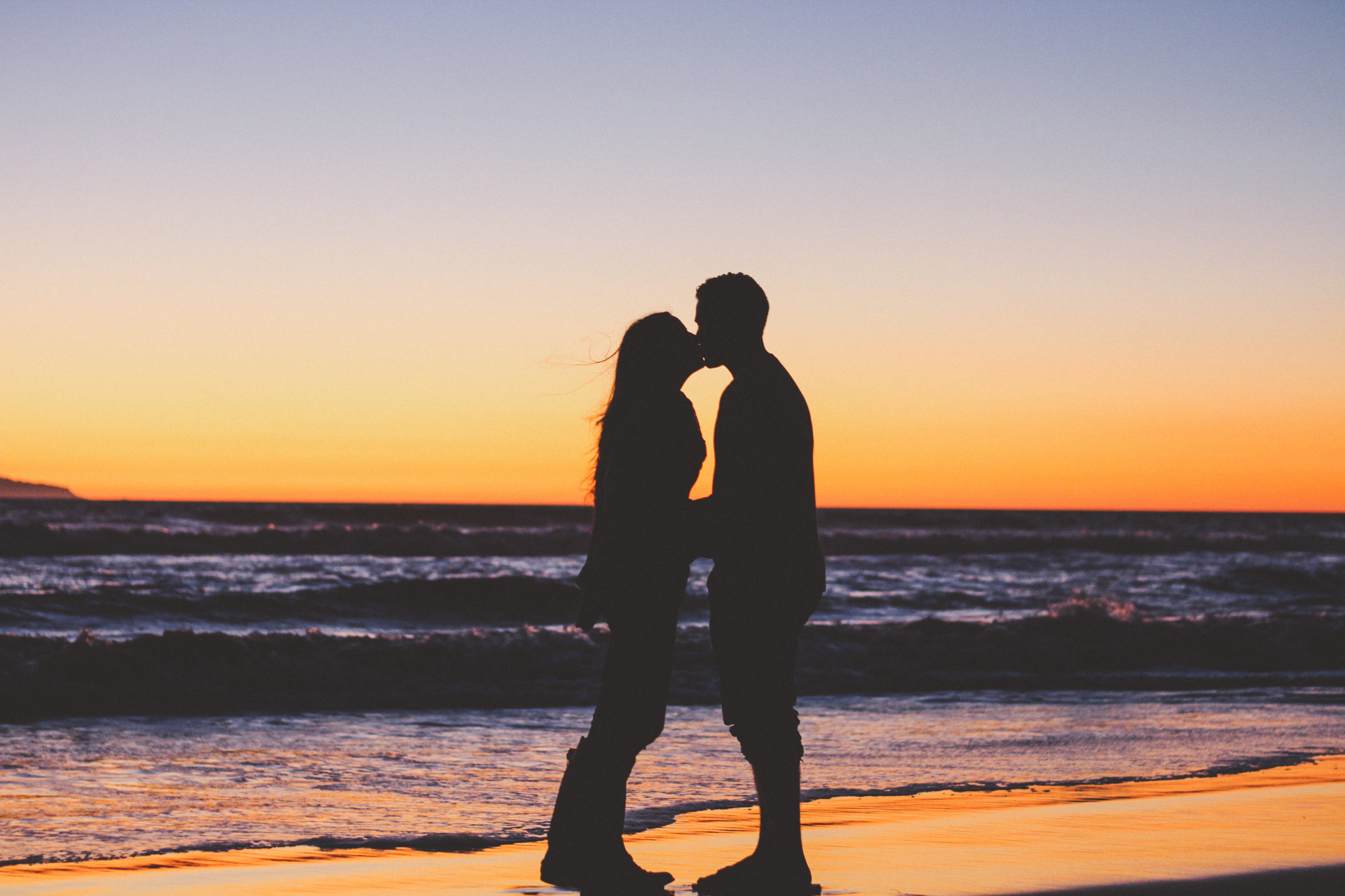 silhouette of couple kissing on shoreline wallpaper, sea, sunset