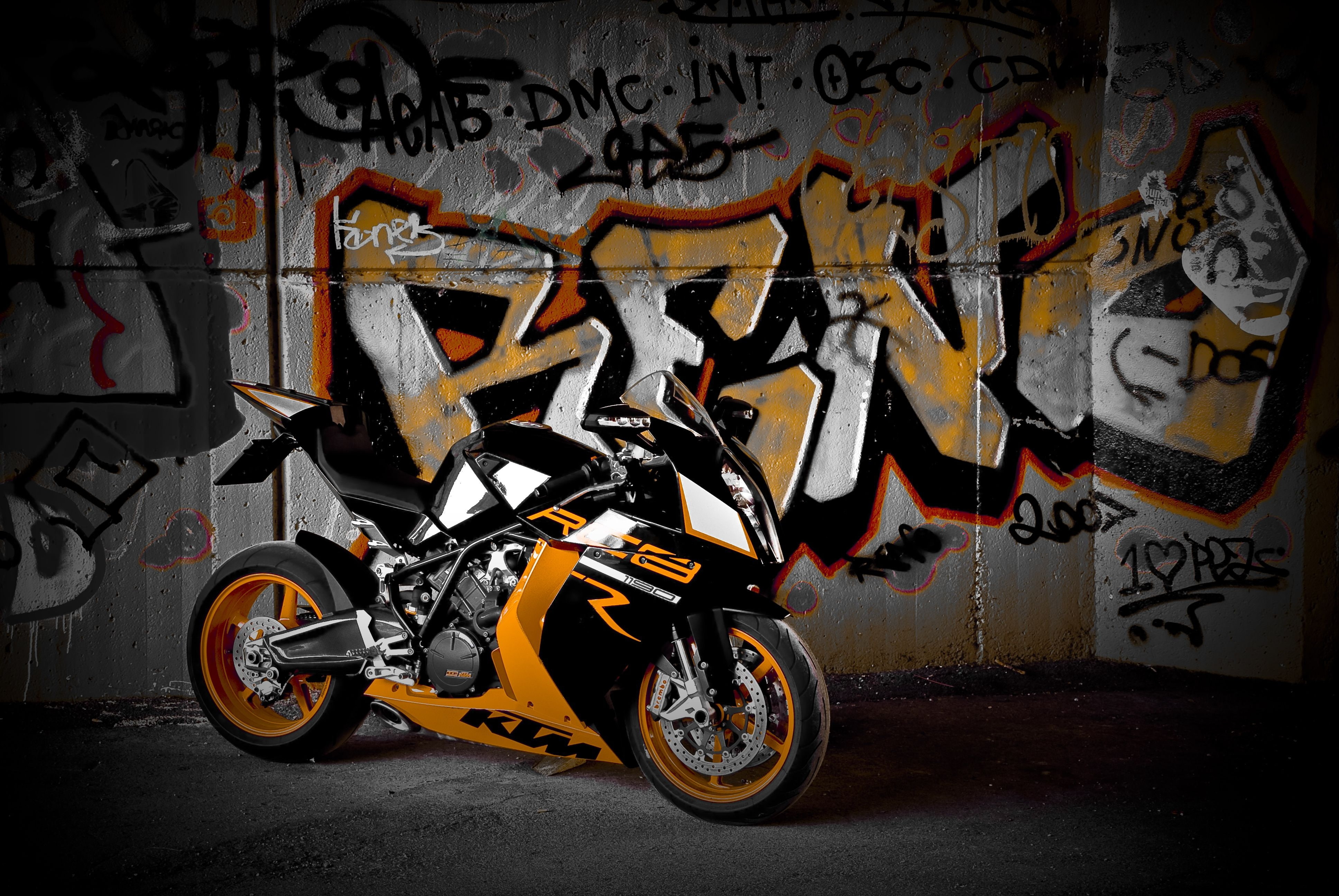 white and orange KTM RC sportbike, wall, black, motorcycle, graffiti