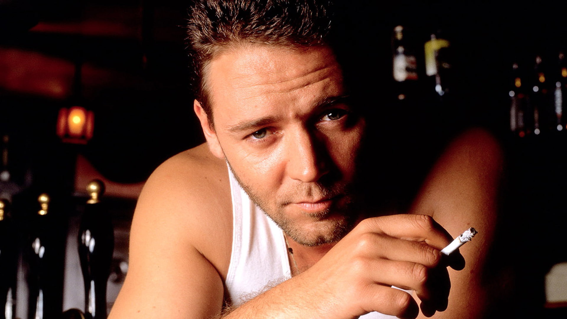 men's white tank top, actor, Russell Crowe, background., one person