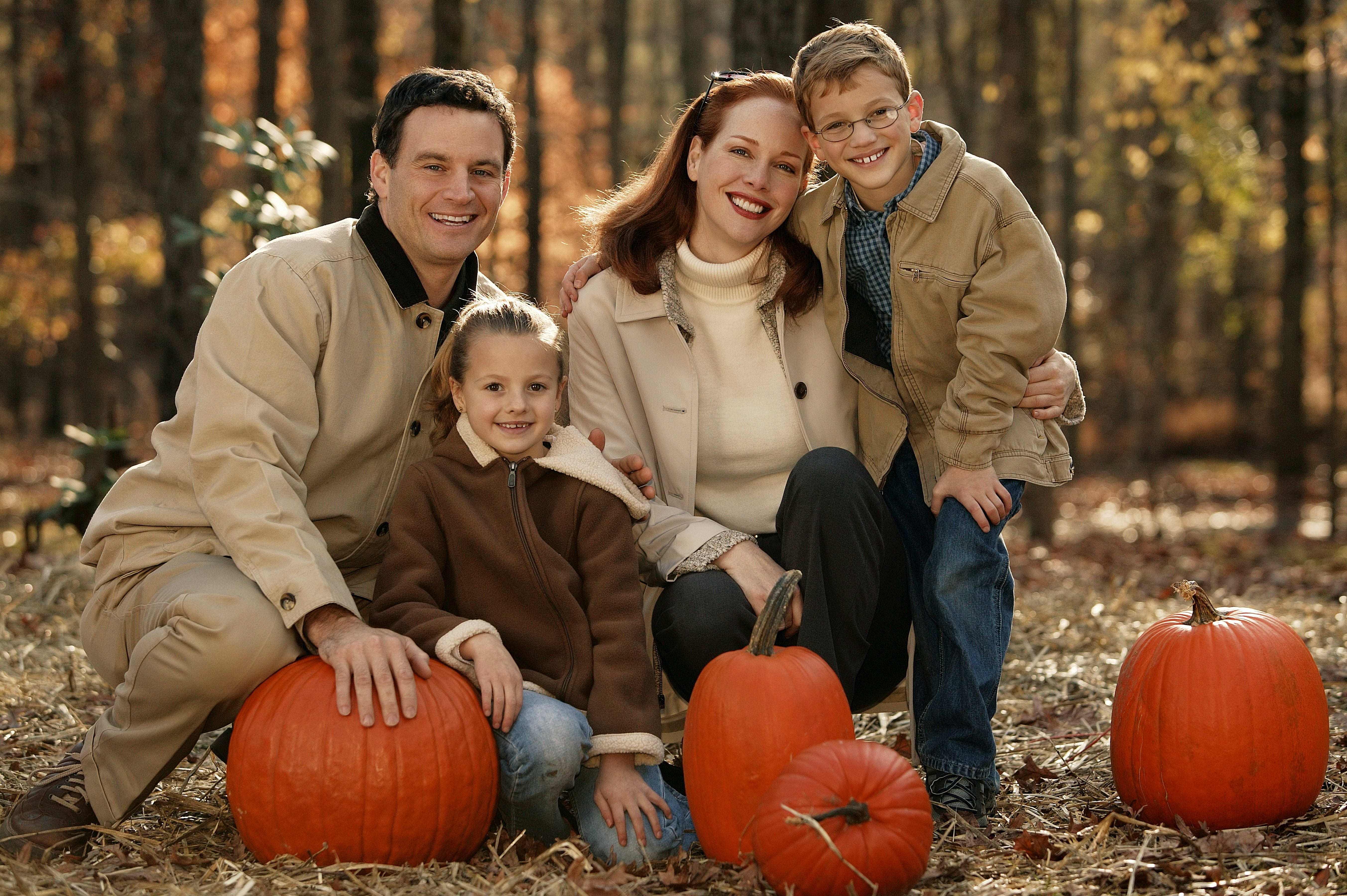 four orange pumpkins, family, finding, forest, autumn, smiling