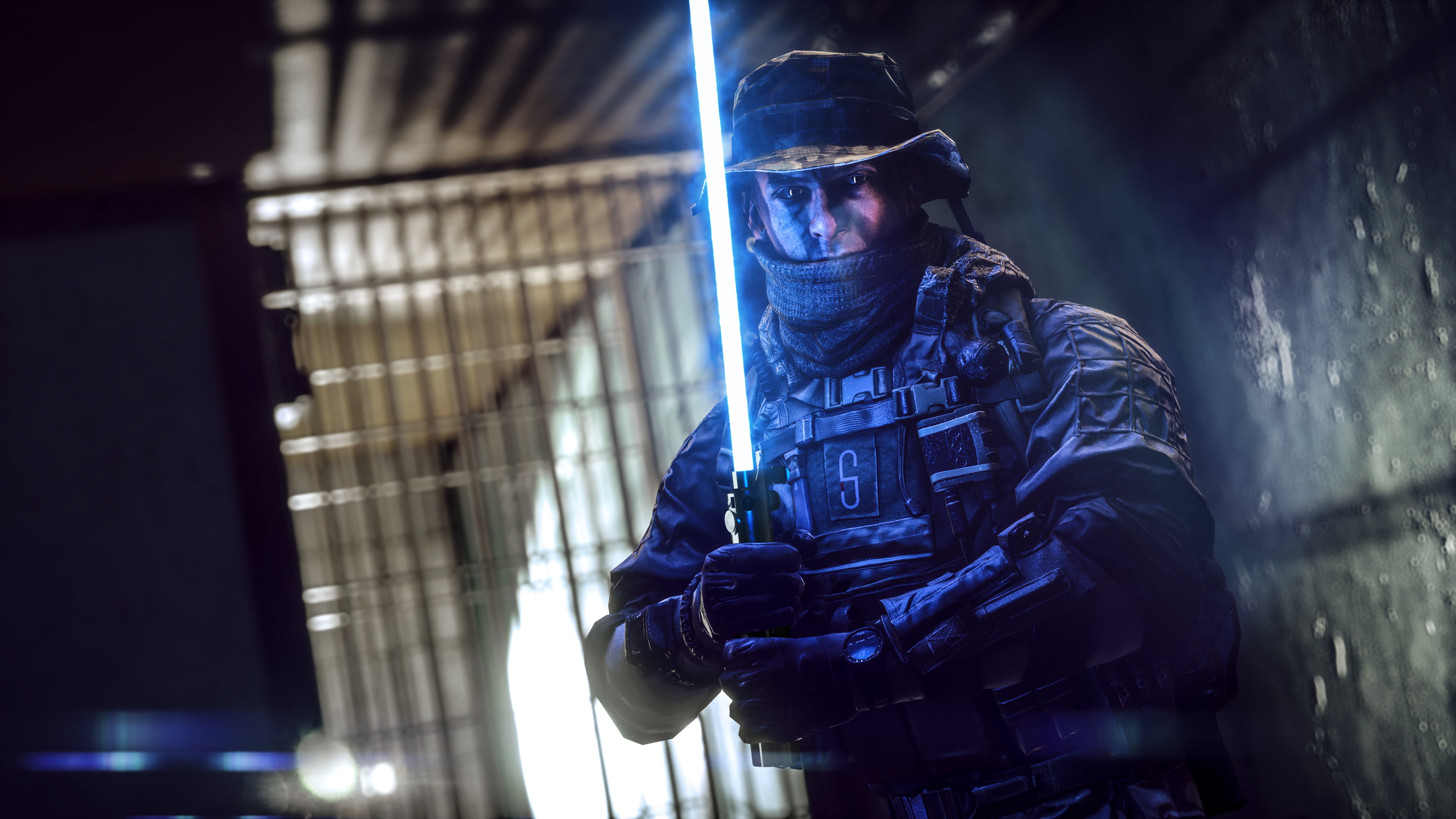 man wearing tactical gear holding blue lightsaber wallpaper, StarField Battlewars