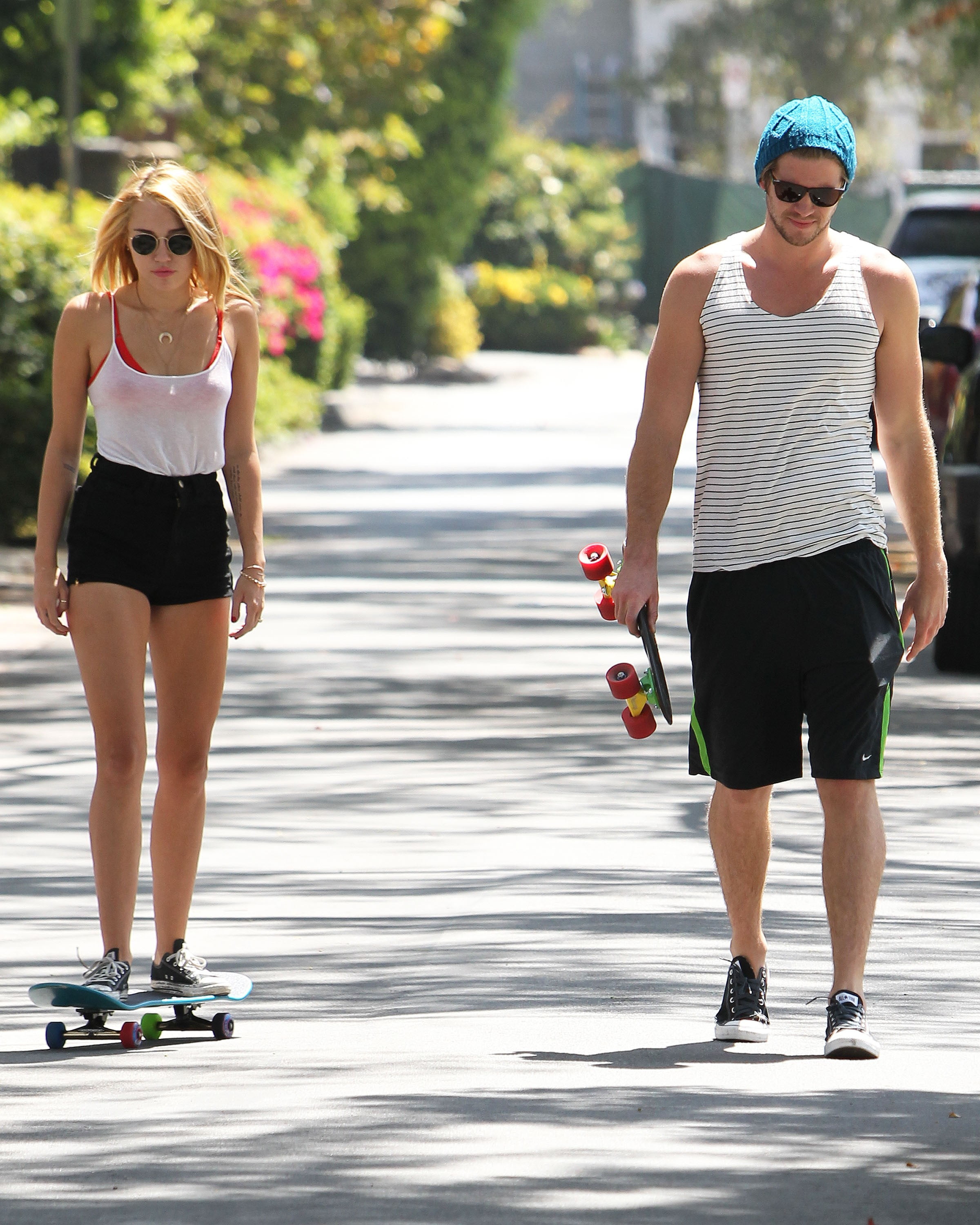Miley Cyrus, Liam Hemsworth, skateboard, full length, lifestyles