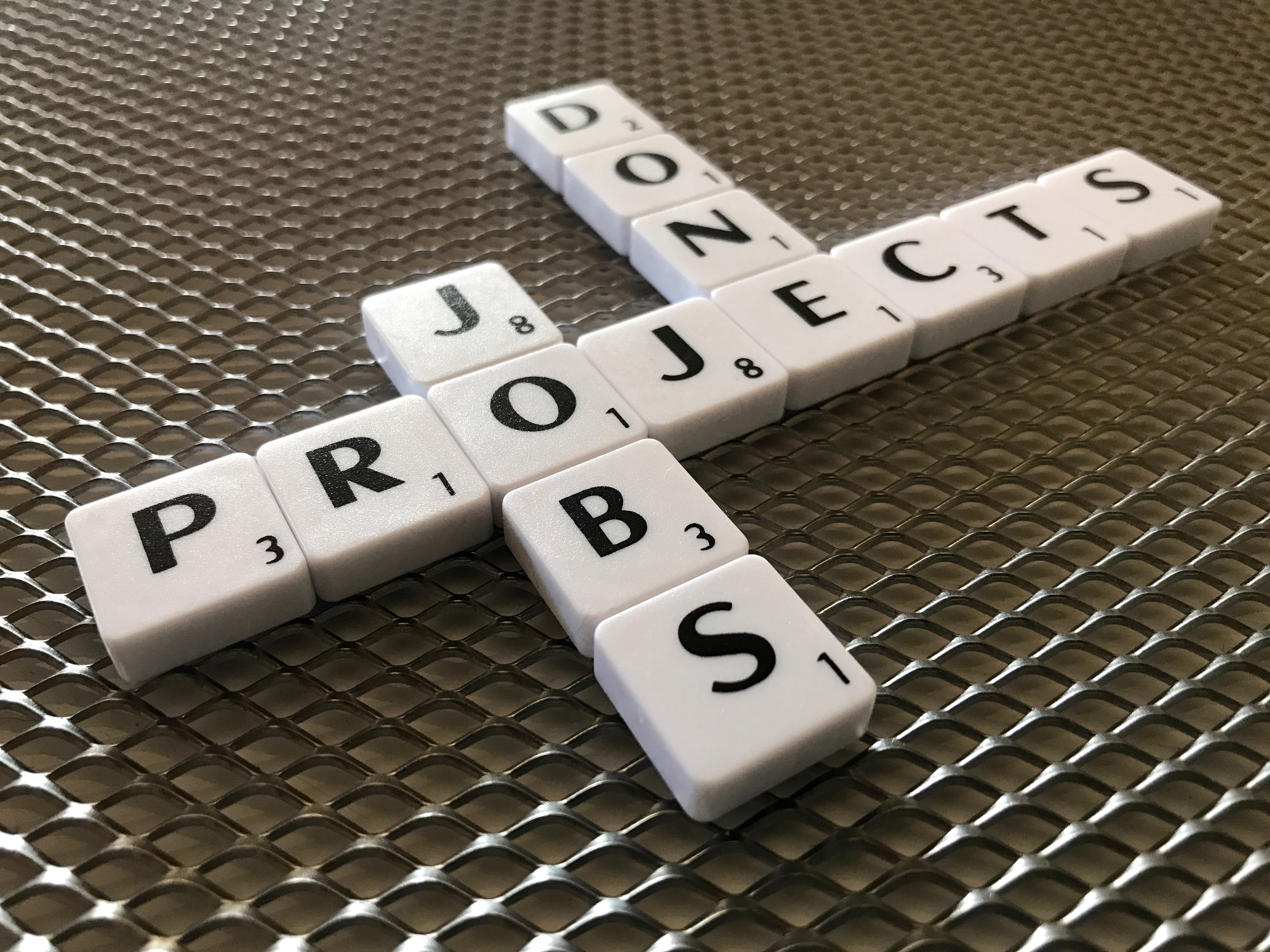 white and black scrabble blocks, letters, words, numbers, surface