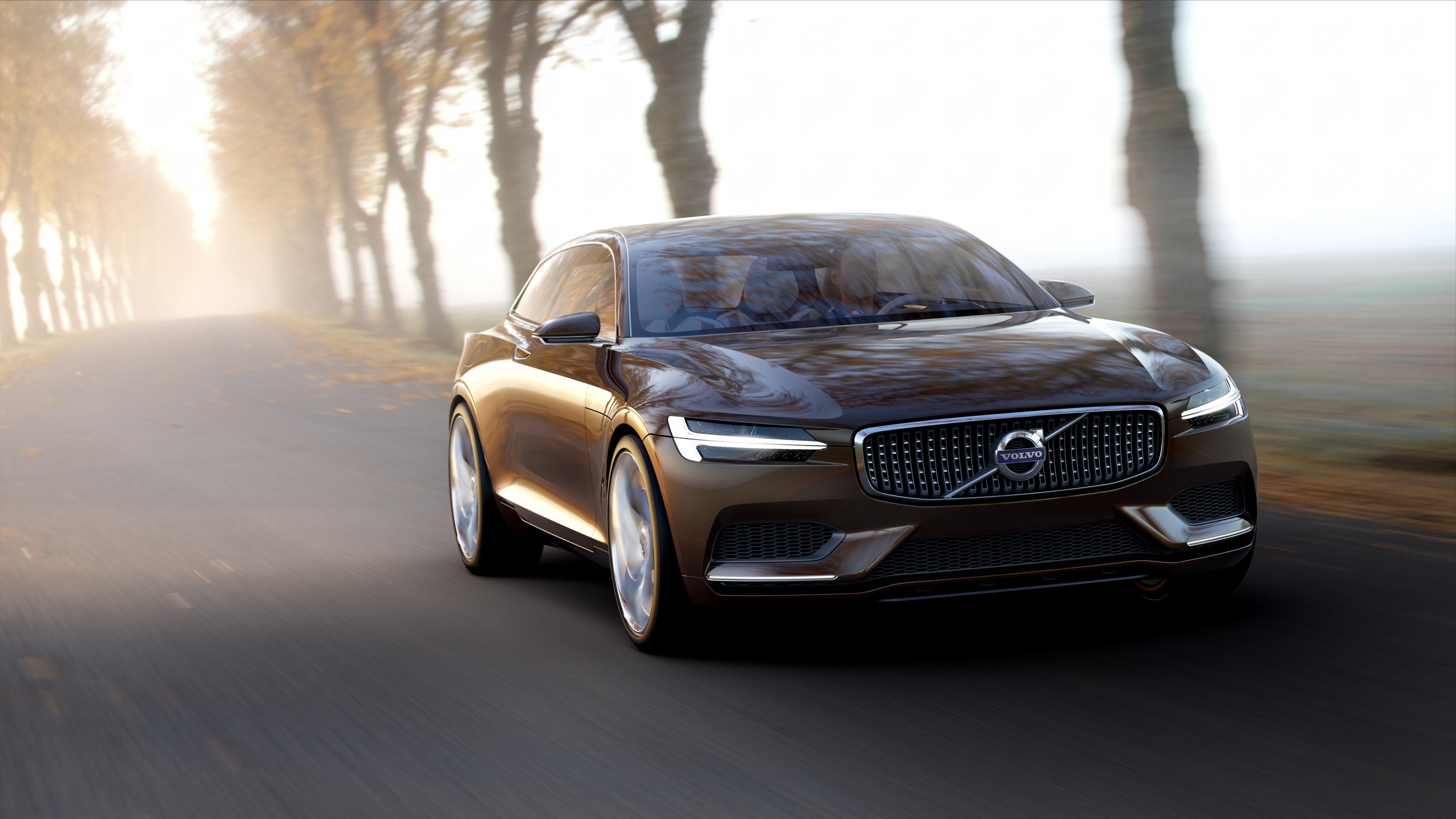 gold Volvo coupe along highway, Volvo S90, sedan, test drive