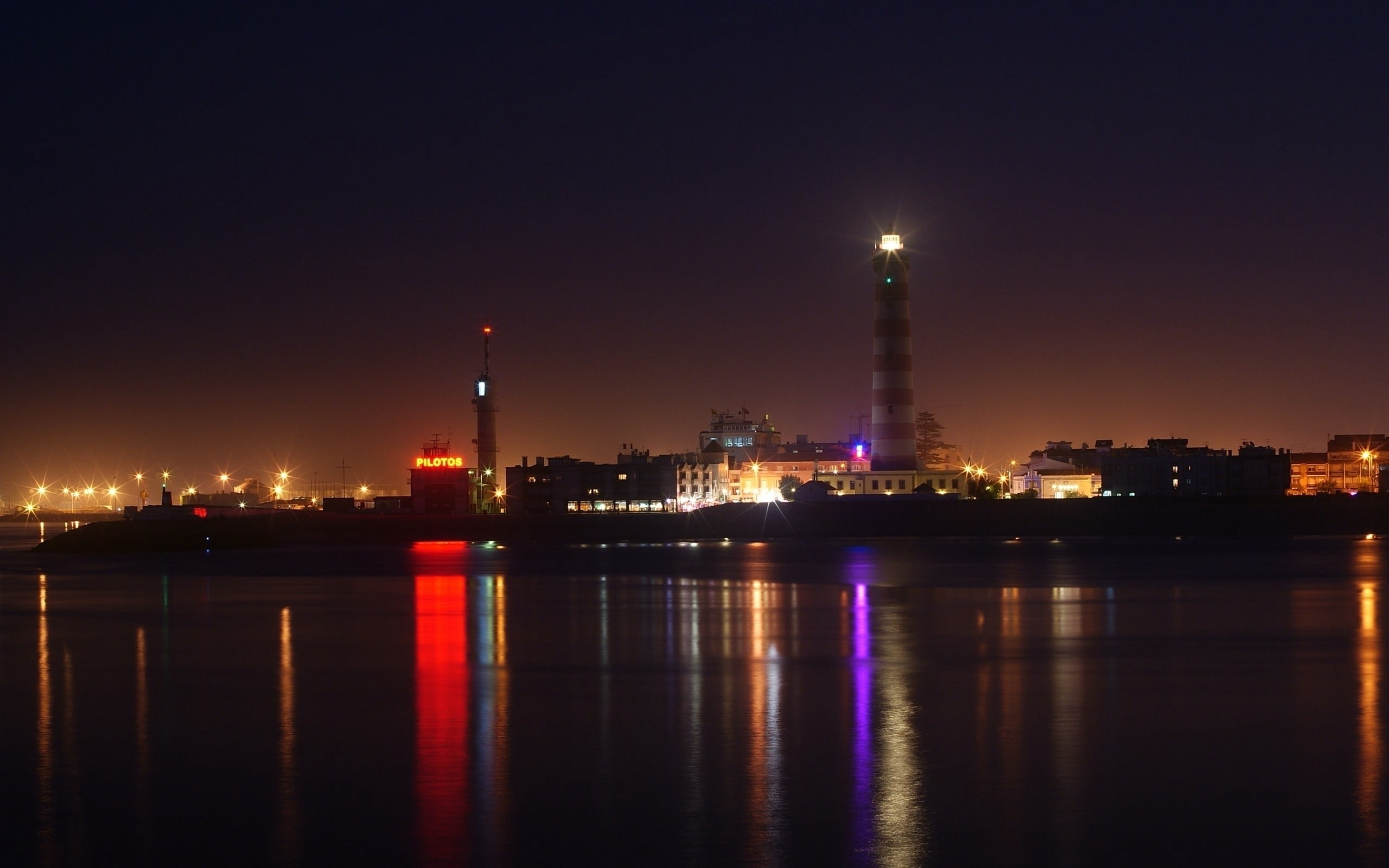 red and white lighthouse, river, beach, sky, night, factory, industry