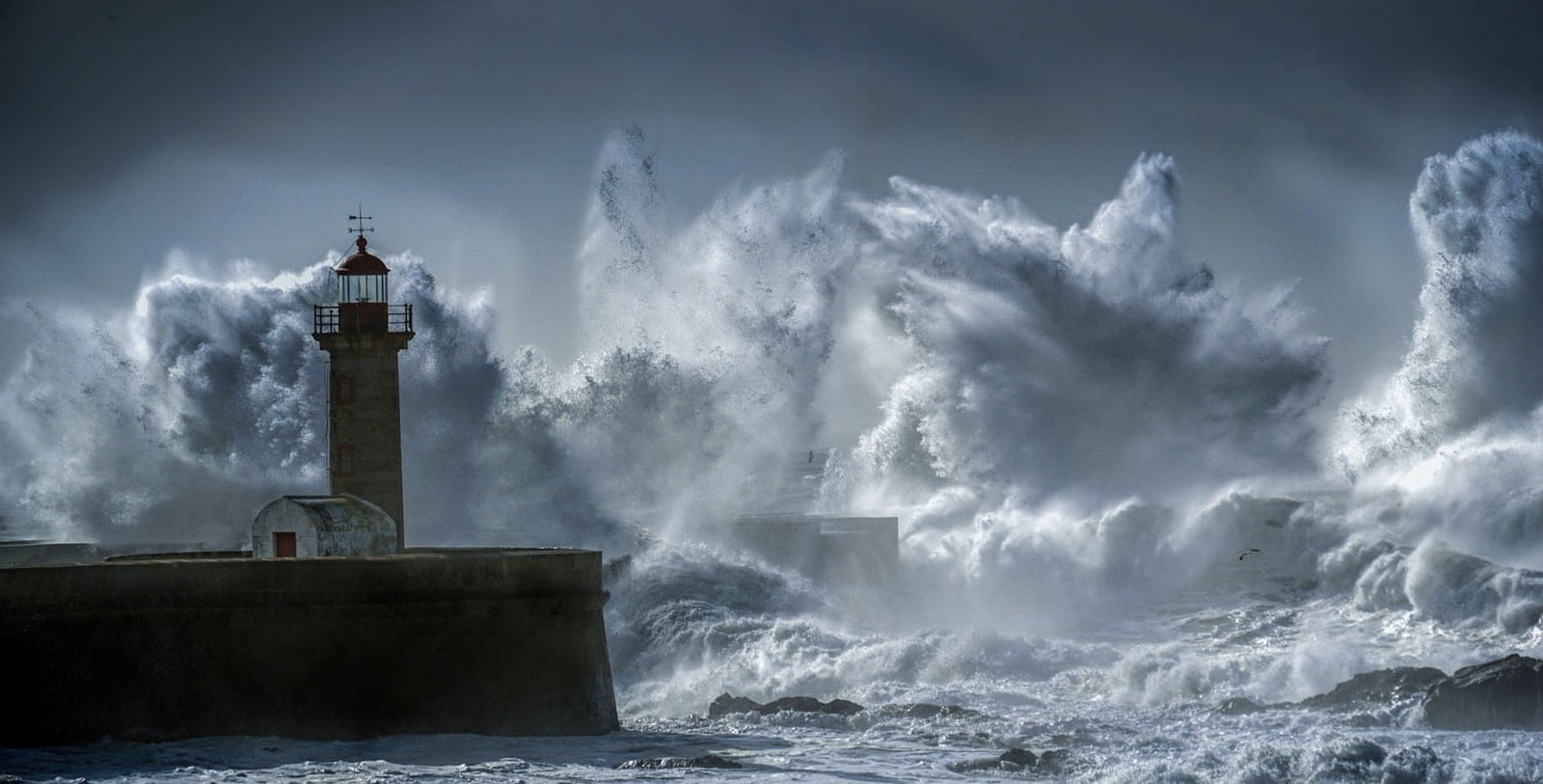 crashing big waves in front of lighthouse illustration, photography
