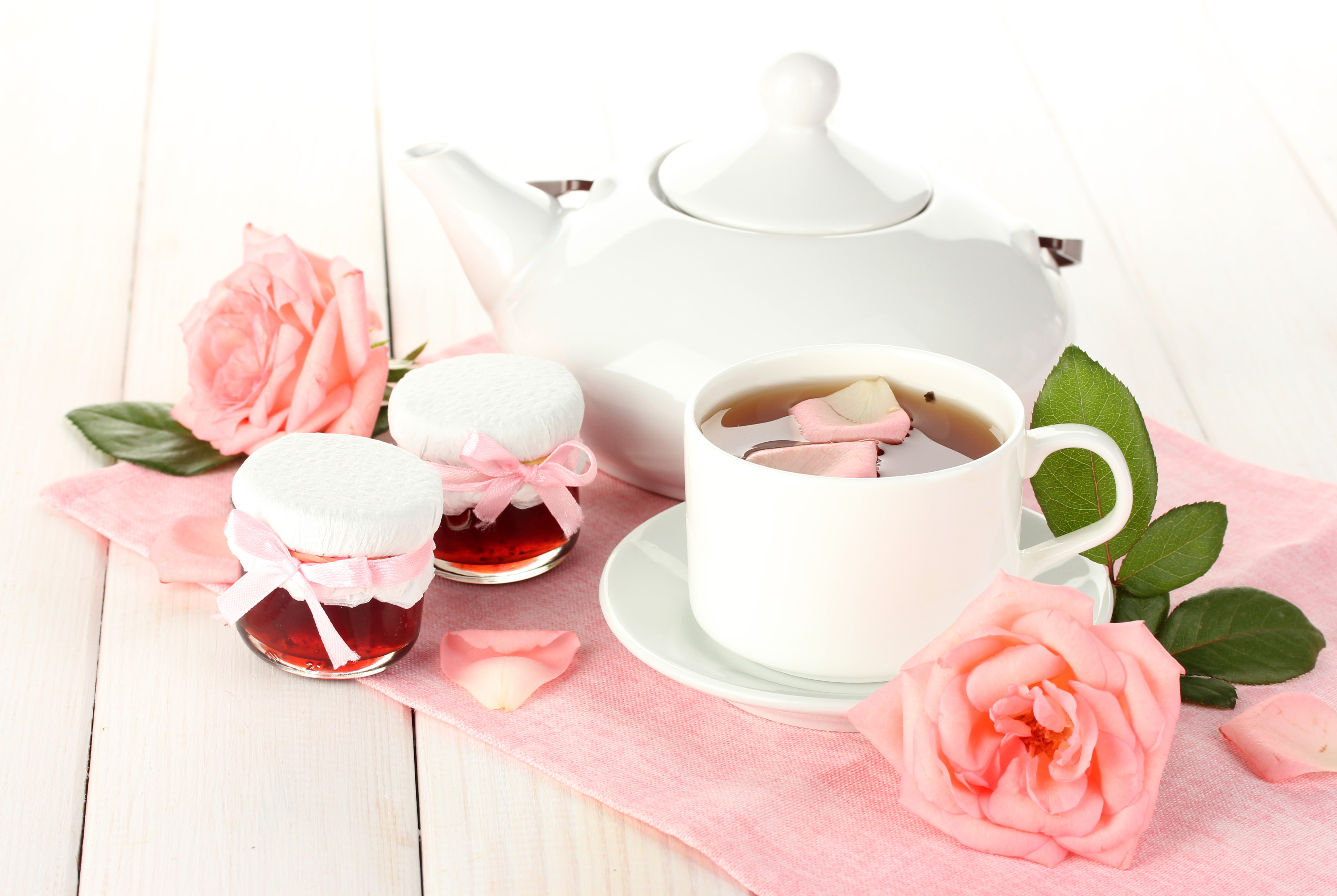 round white ceramic mug, leaves, flowers, tea, roses, petals