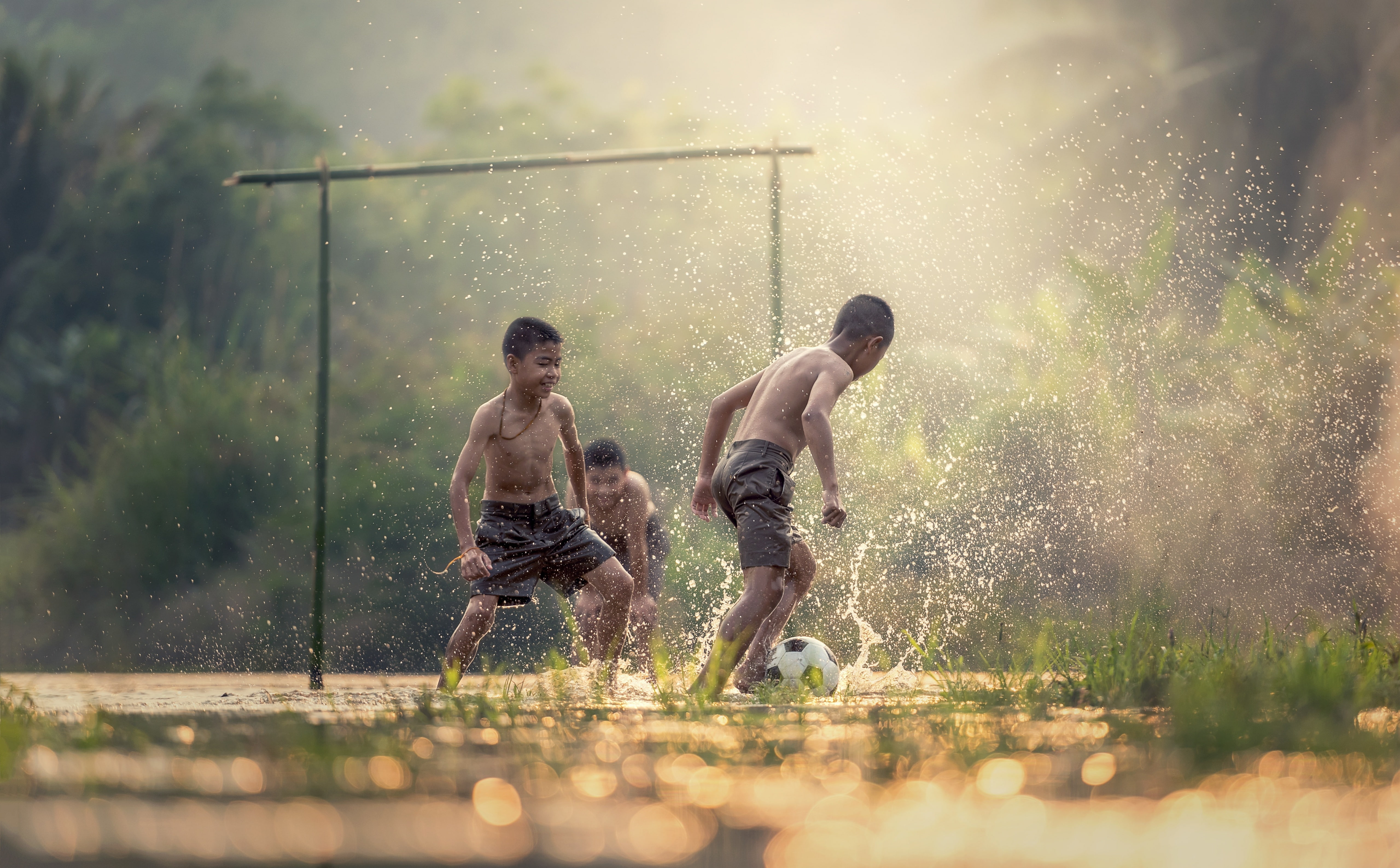 Asian Kids Playing Soccer, boy's gray shorts, Thailand, Drops