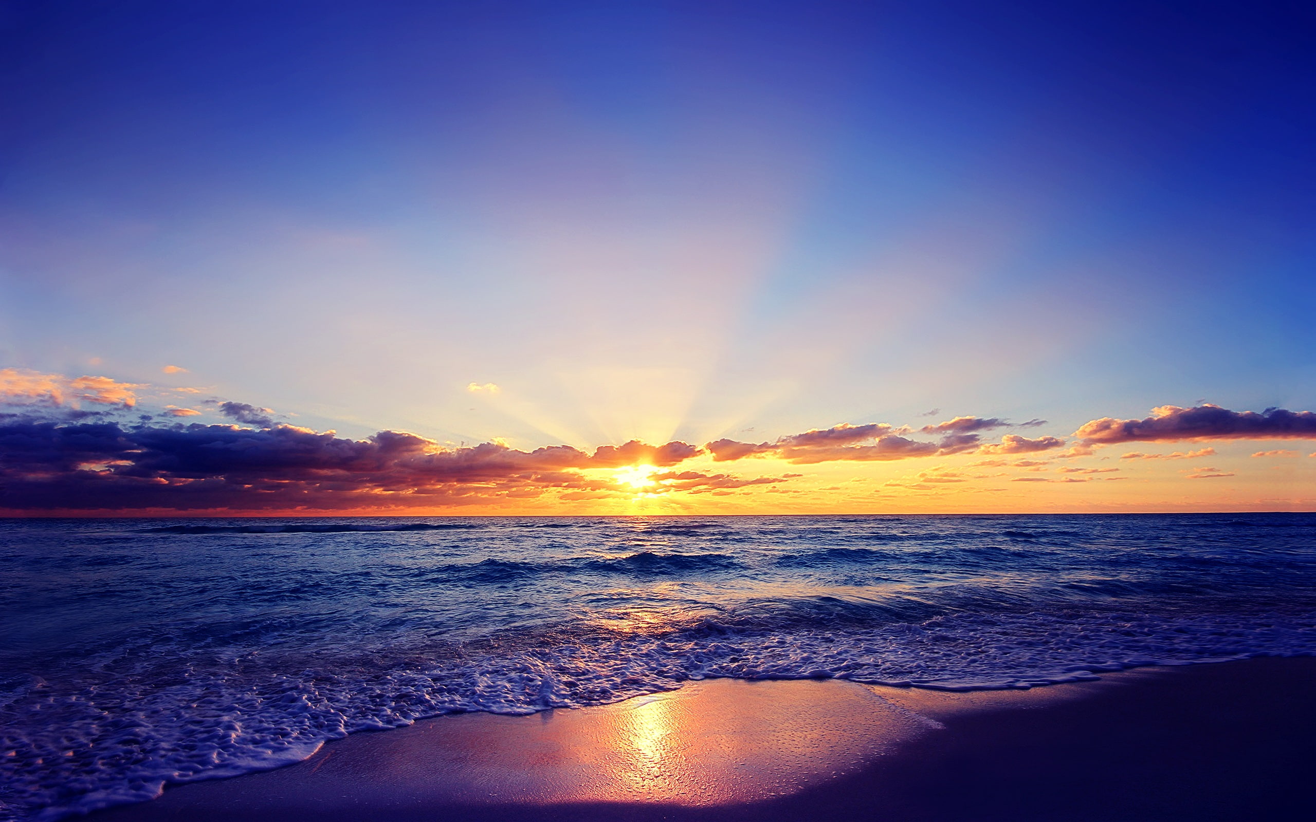 Beautiful sunset, sun, sea, waves, beach, clouds, sunrise at the beach