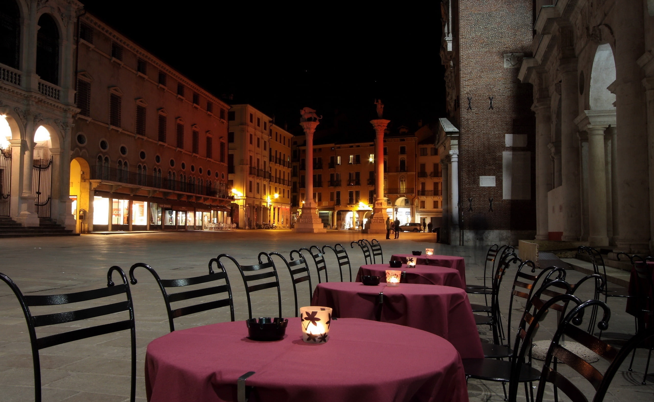 Venice At Night, several pink tablecloths black-and-brown ladderback armless chairs