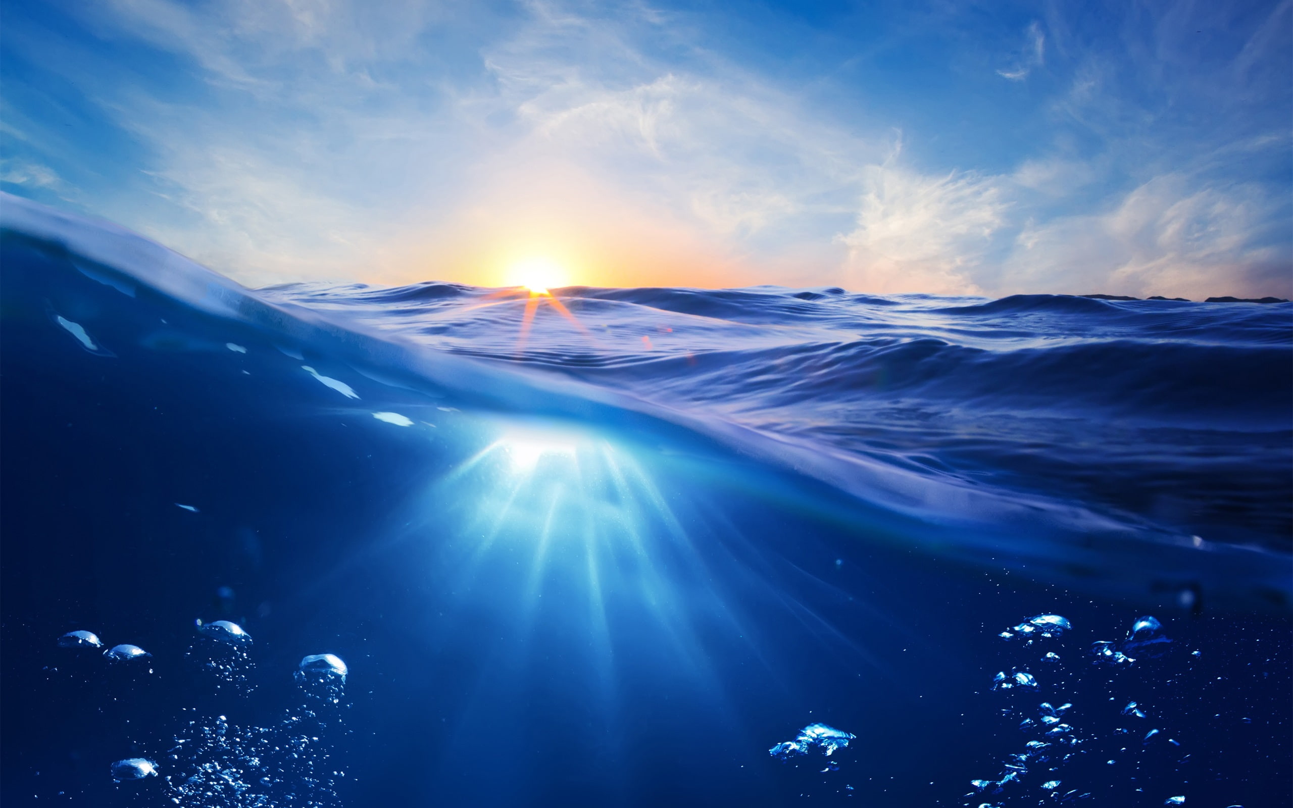 Ocean, sunset, sun, blue water, bubbles