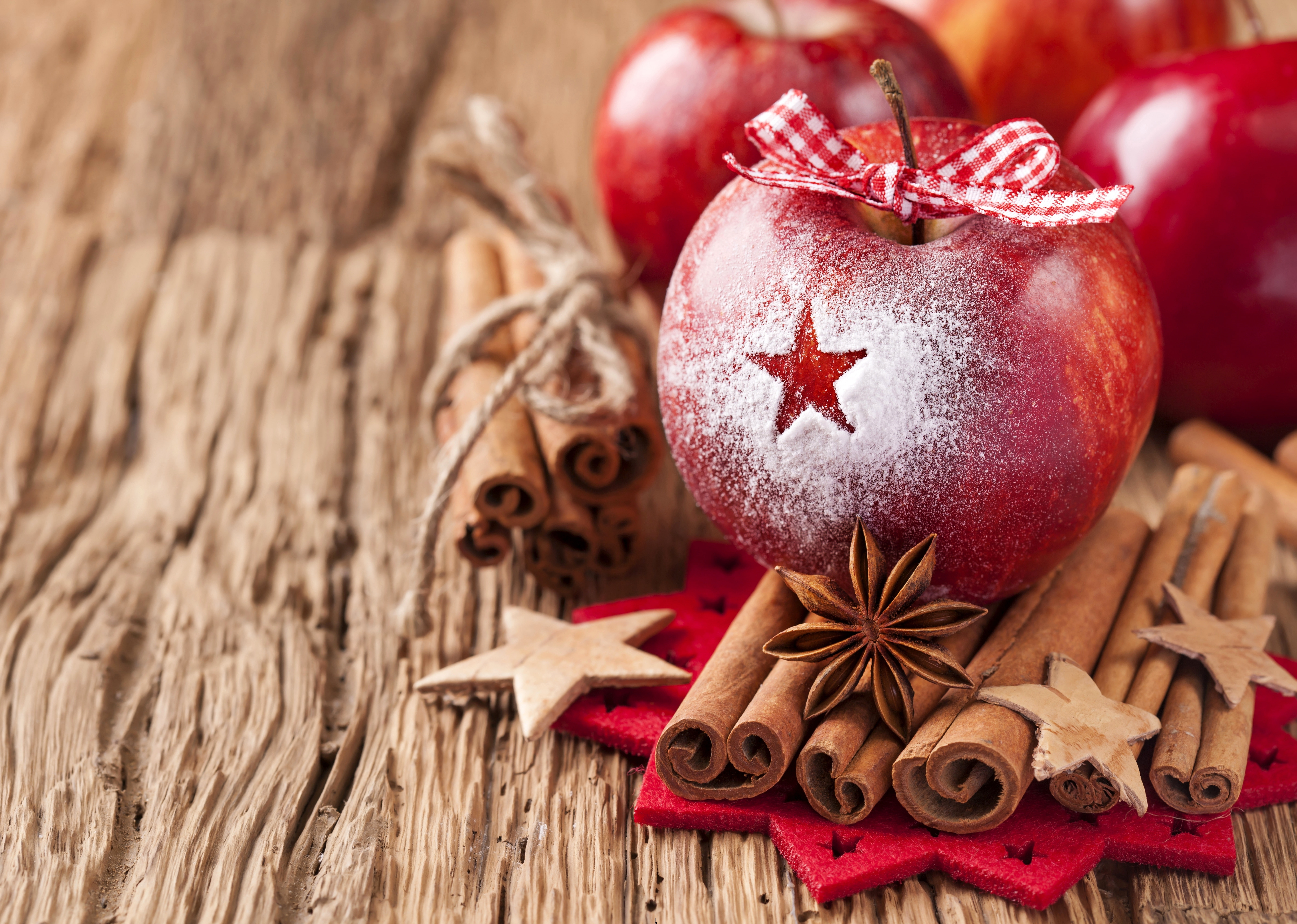 four red apples, star anis, and cinnamons, winter, sticks, bow