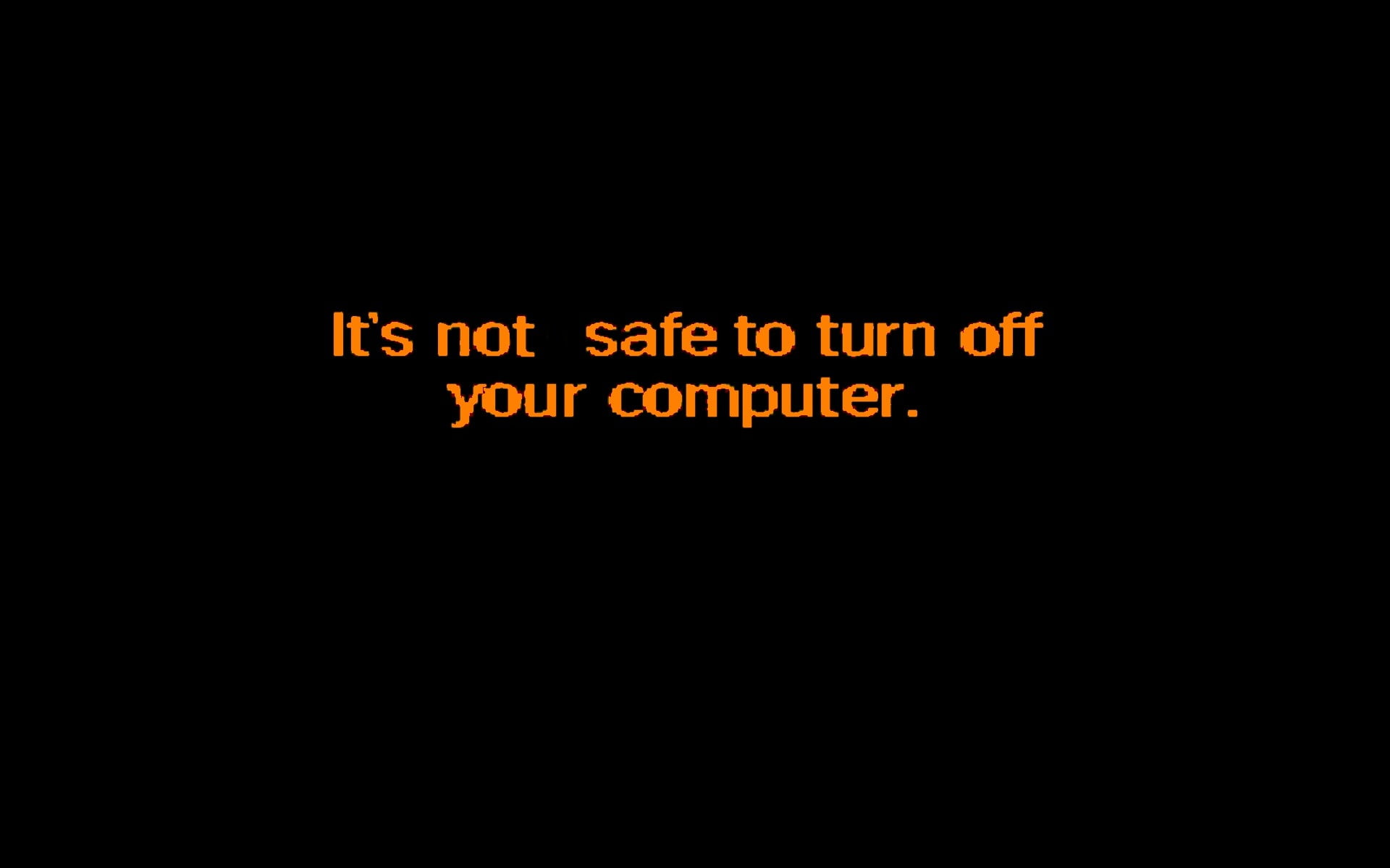 black background with It's not safe to turn off your computer
