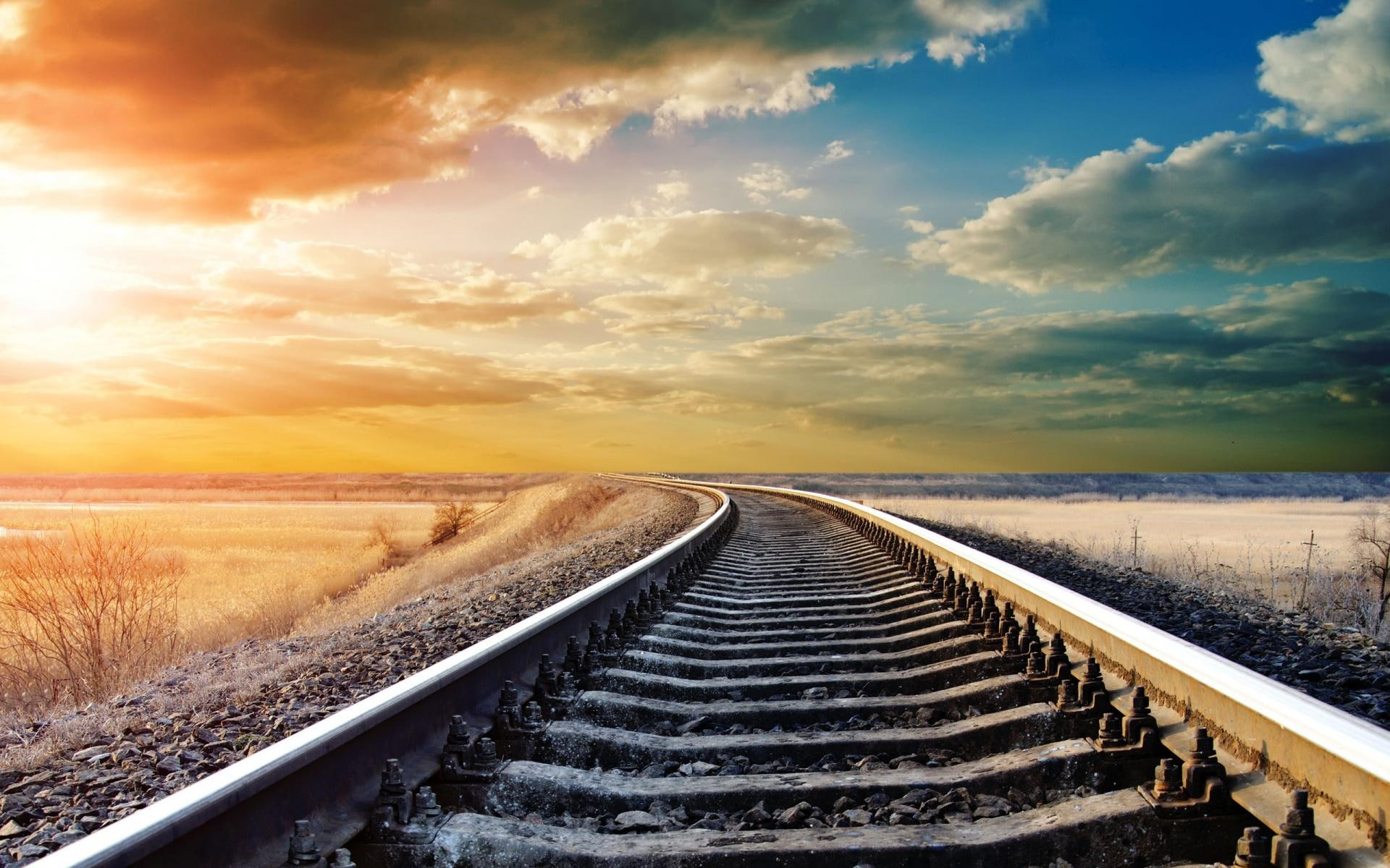 Train Tracks To The Setting Sun, rail road, gravel, fields, clouds