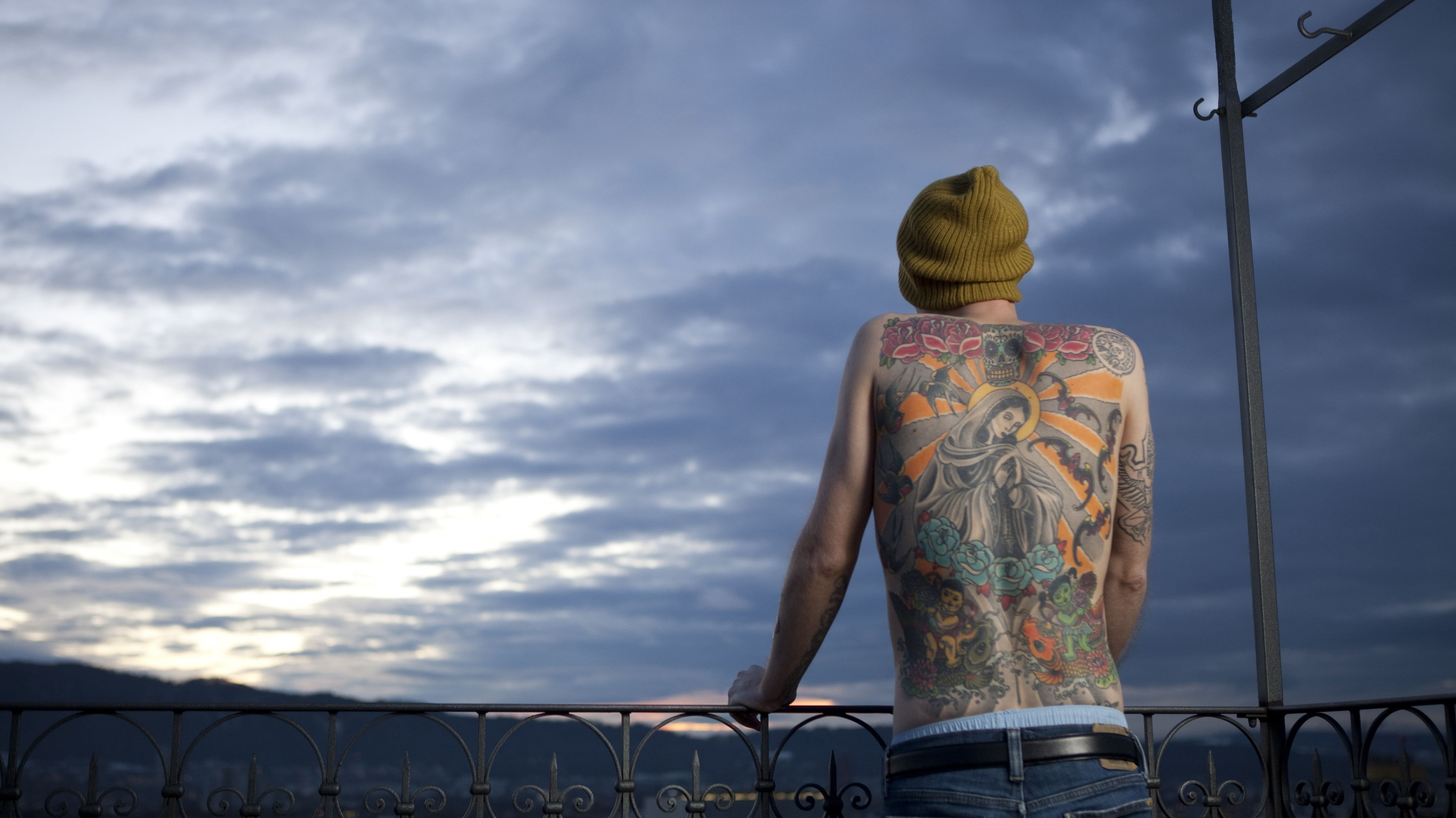 man with back tattoo under white clouds, Tim Steiner, Virgin Mary