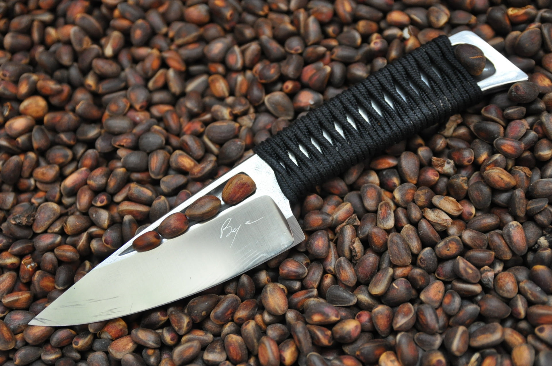 black handle dagger, knife, nuts, cord, cedar, braid