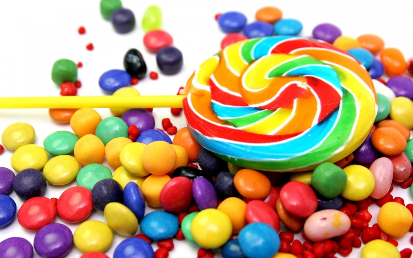 assorted-color candies and multicolored lillipop, candy, jelly beans