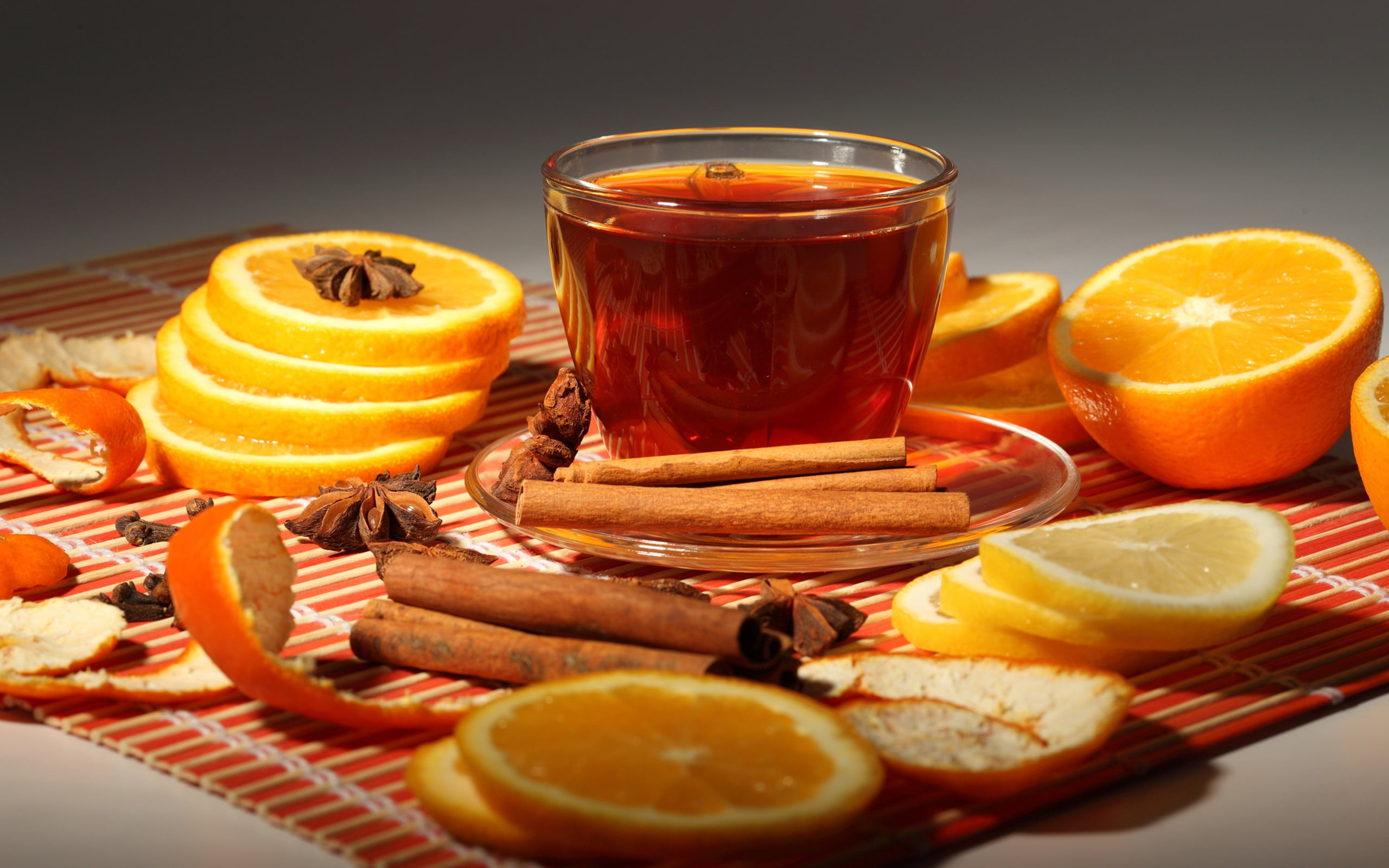 brown liquid and clear glass cup, oranges, cinnamon, tea, orange - Fruit