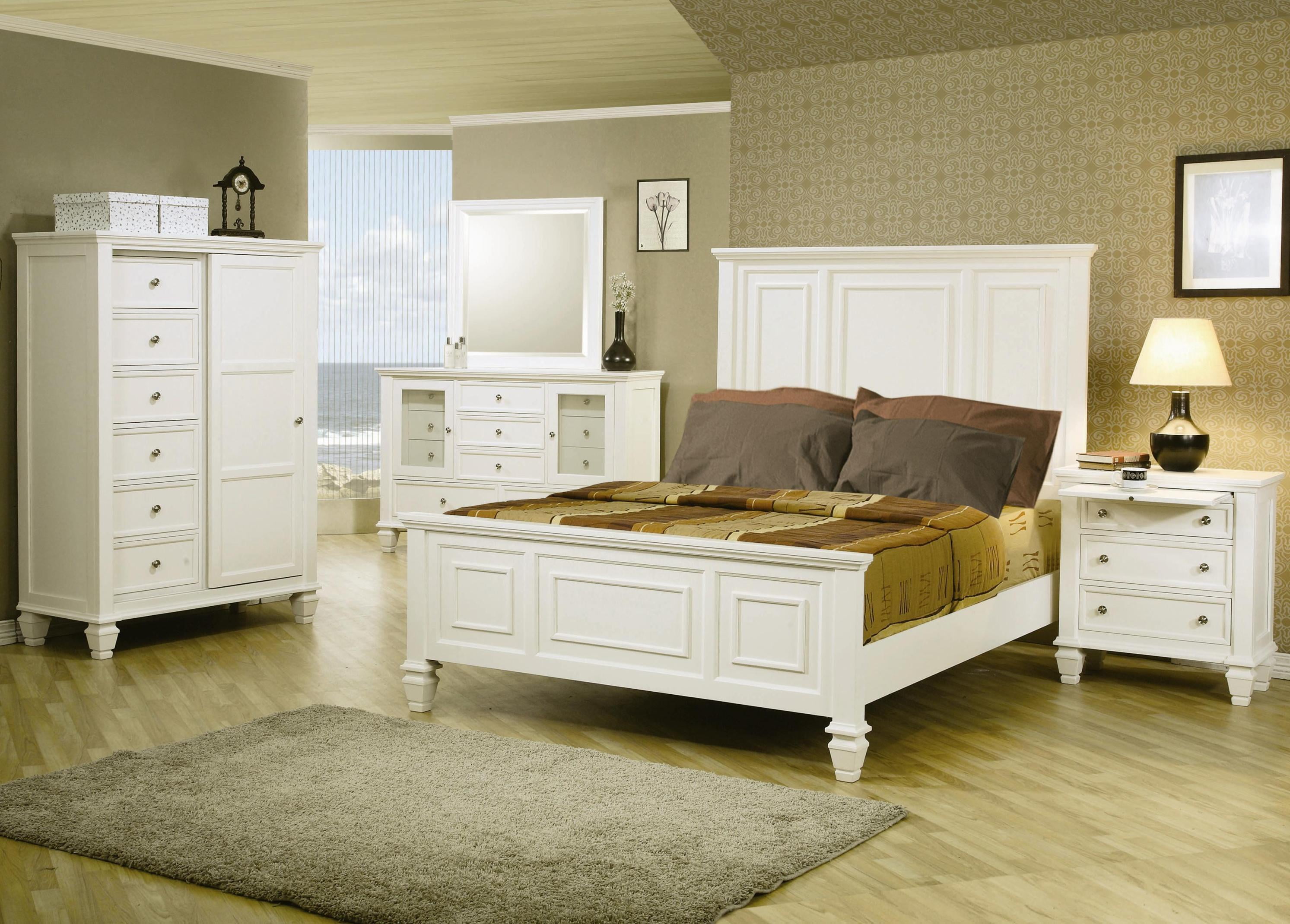 white wooden bed frame; wooden 3-drawer nightstand; tallboy dresser; gray area rug