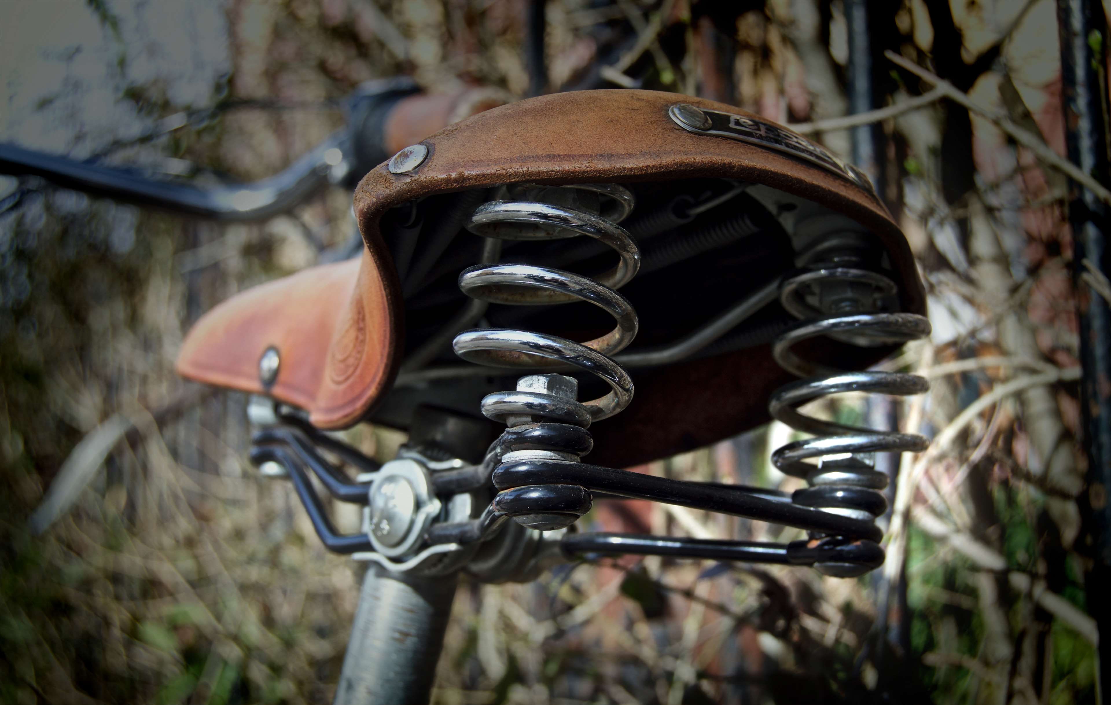 bicycle, bicycle saddle, bike, blur, close up, coil, leather seat