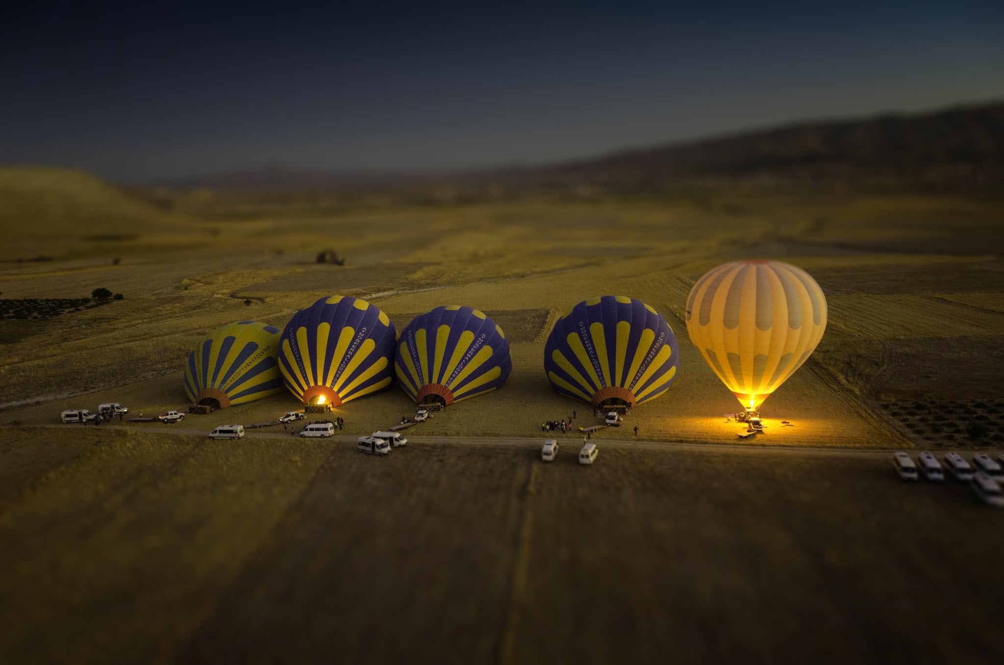 five hot air balloons, miniature of five hot air balloons, landscape