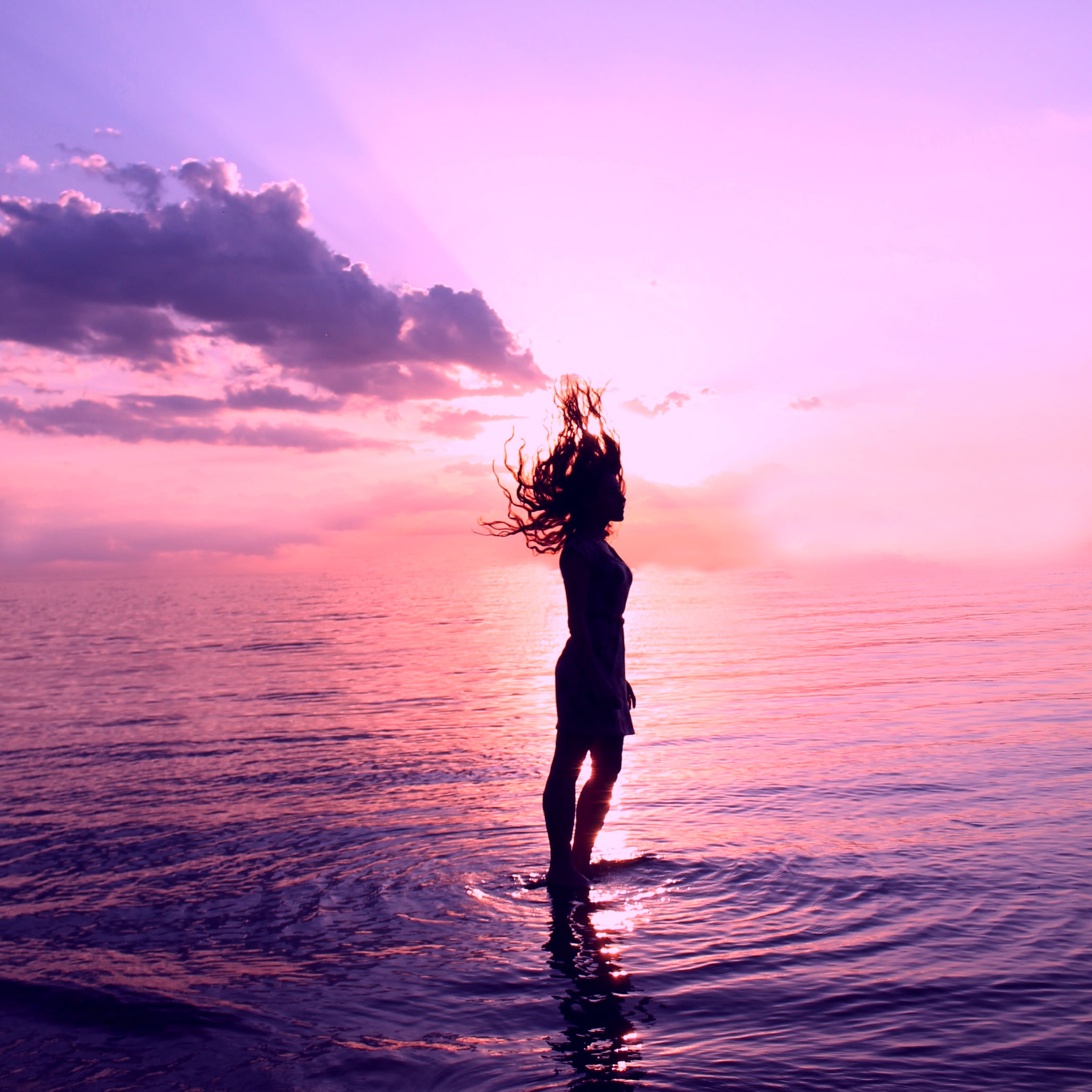 silhouette photo of a woman standing on a body of water, self-portrait