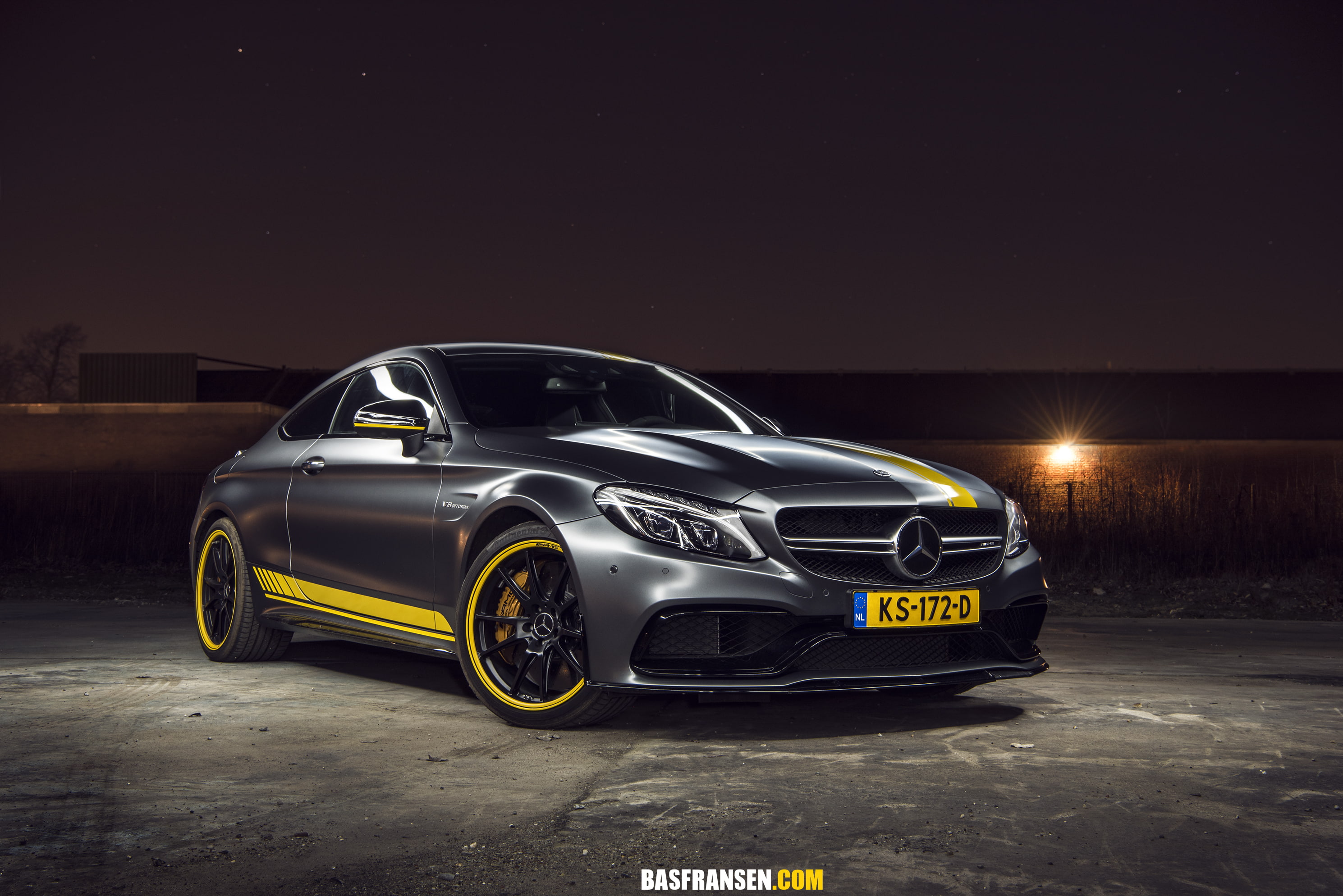 silver and yellow Mercedes-Benz coupe parked on concrete ground