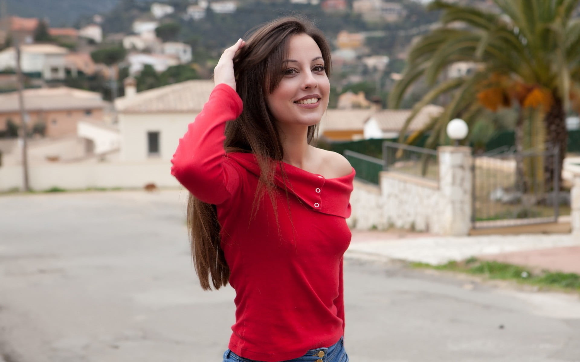 women's red long-sleeved blouse, selective focus photo of woman wearing red off-shoulder long-sleeved shirt