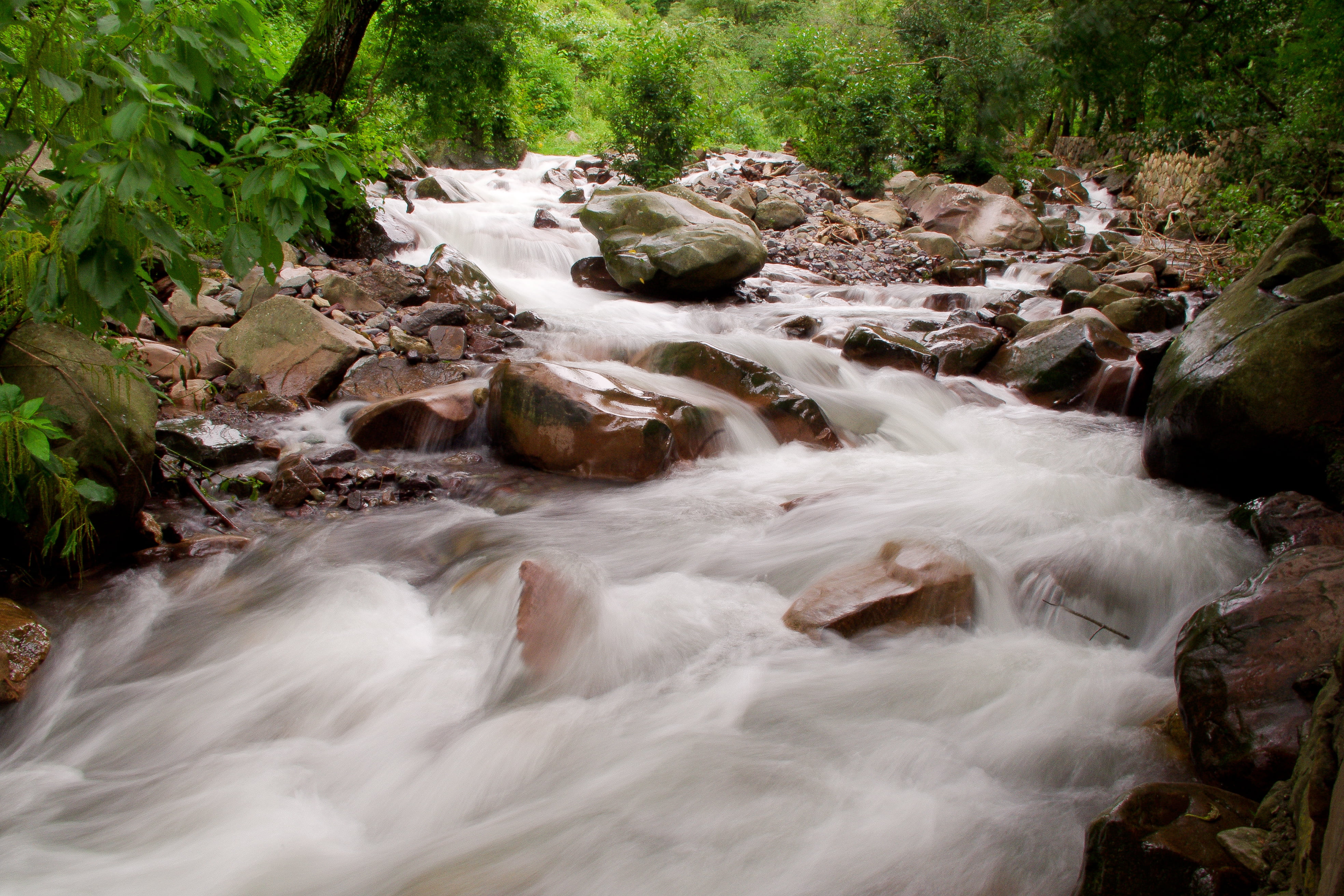 time-lapse photography of raging river with brown rocks at daytime, green river, green river