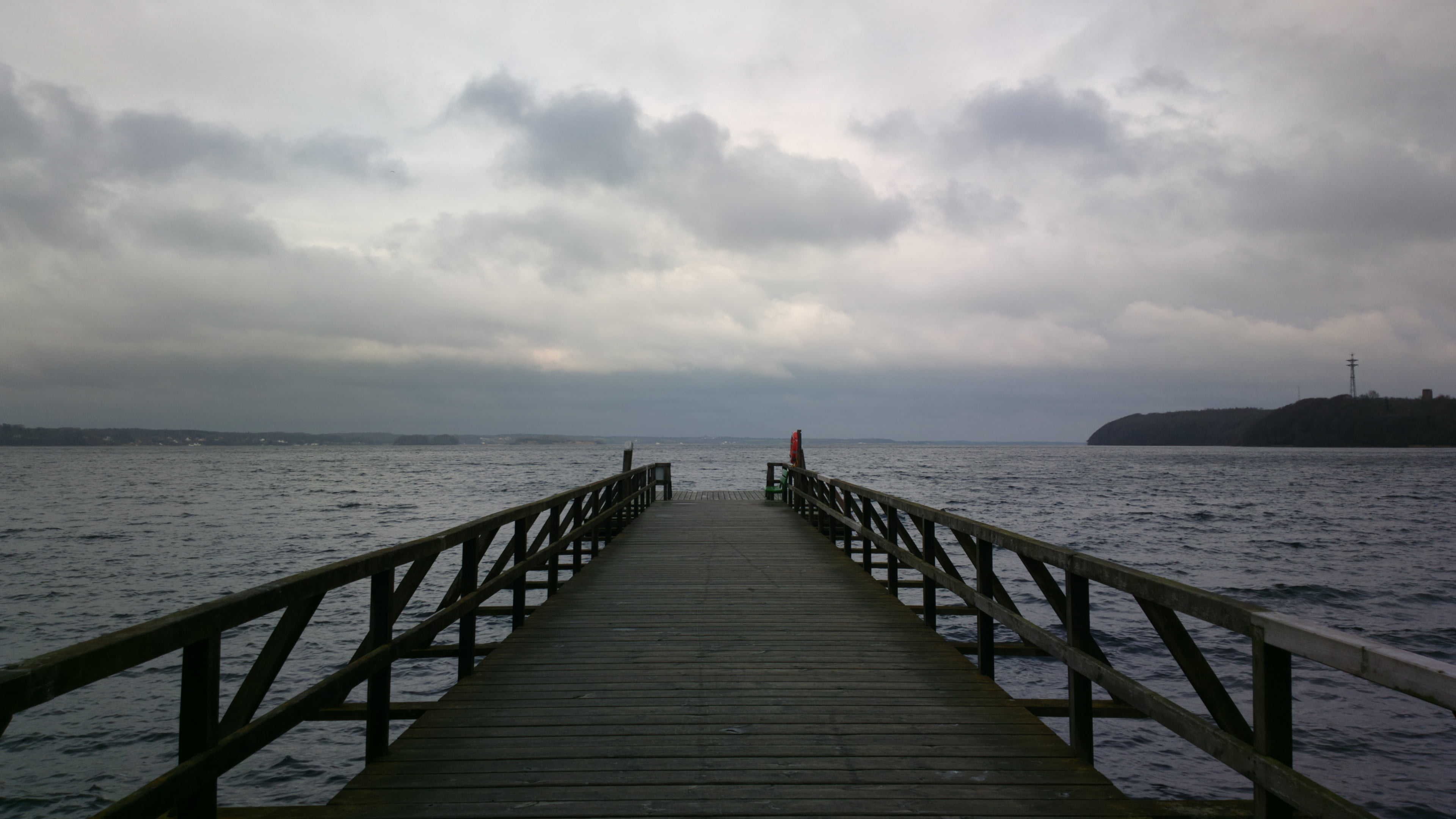 person taking photo of gray wooden dock under gray clouds, Nokia  808  Pureview