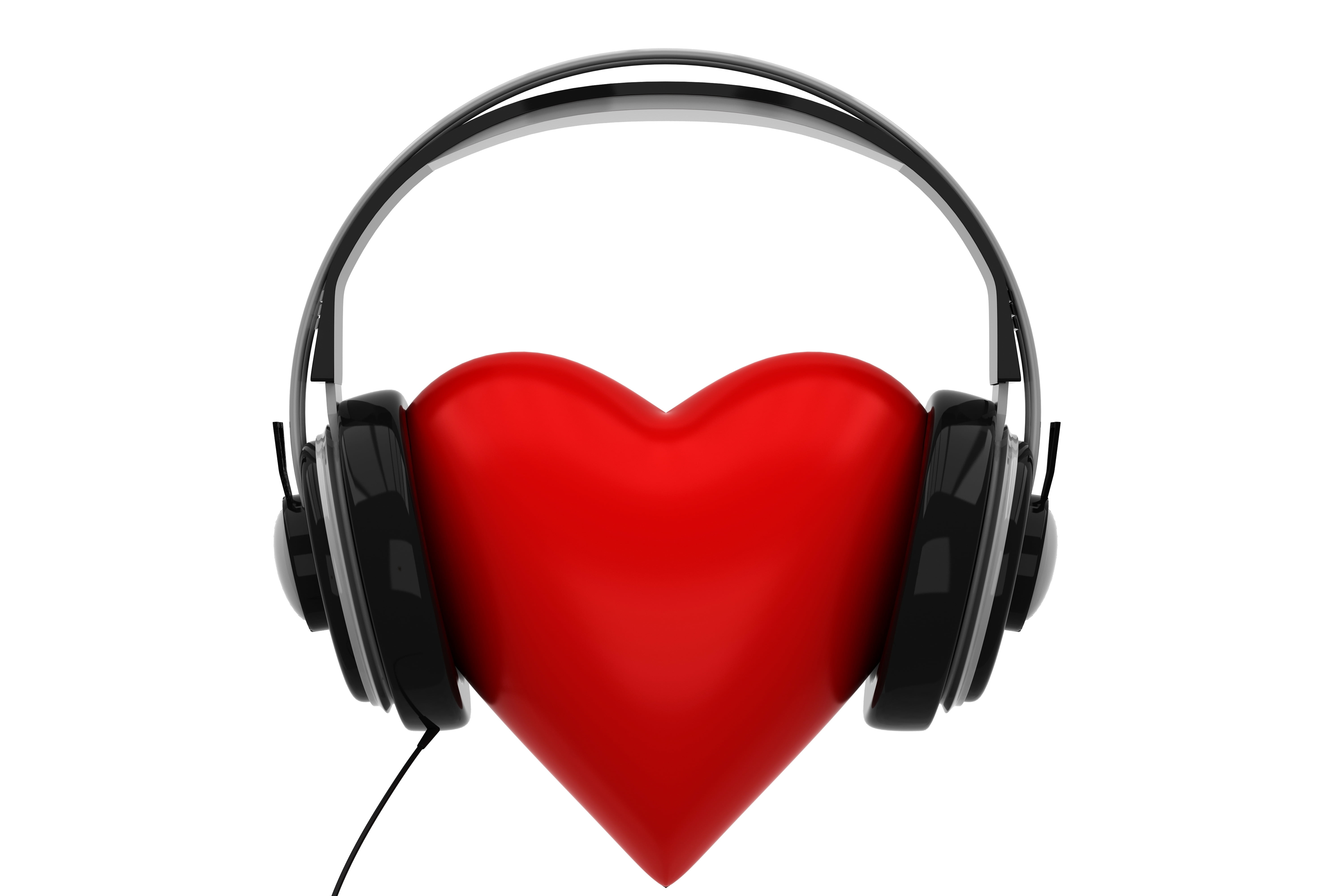 black corded headphones and red heart, listening, isolated, equipment