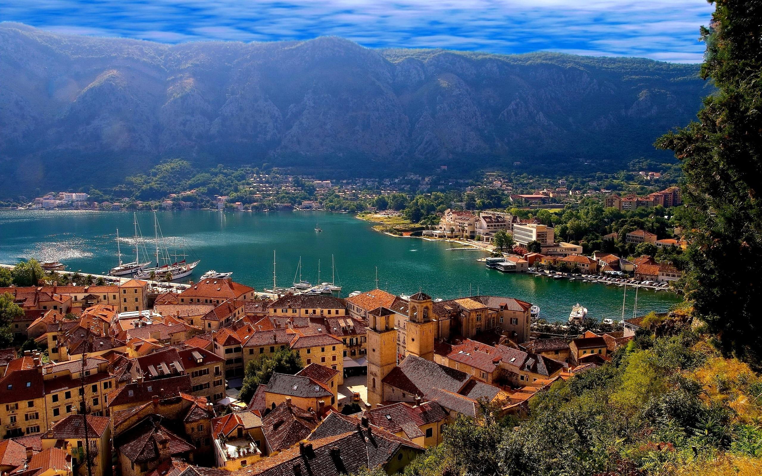 Perfect town, houses beside body of water and mountains, world