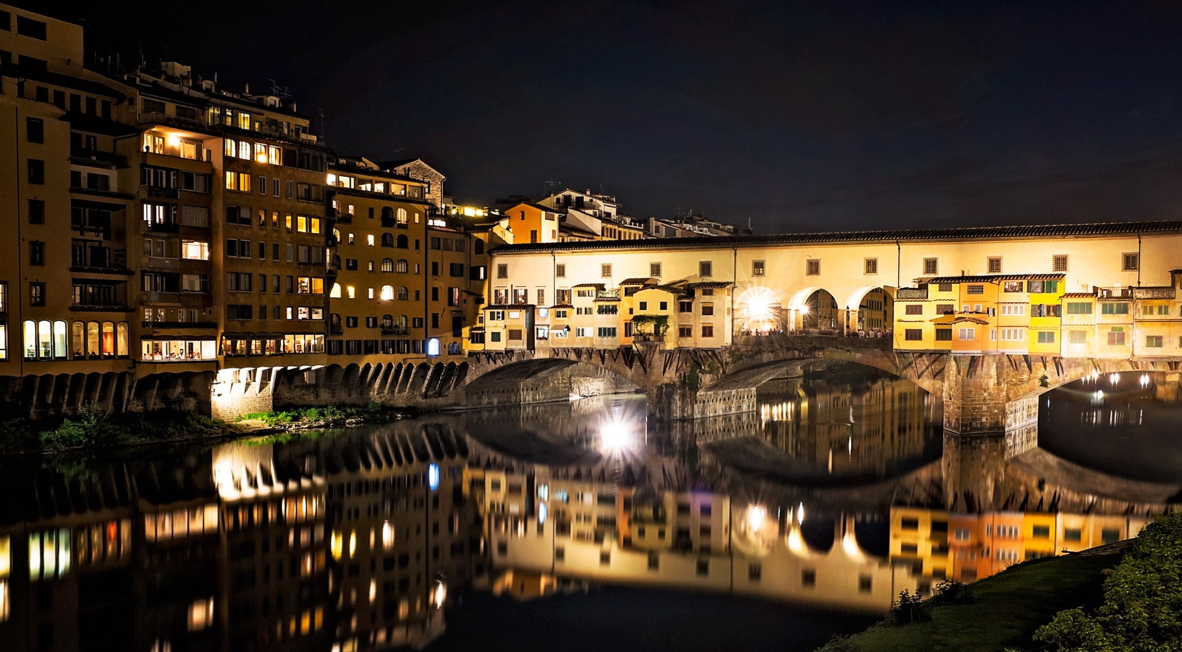 Ponte Vecchio at night, Florence, Italy, beige concrete building