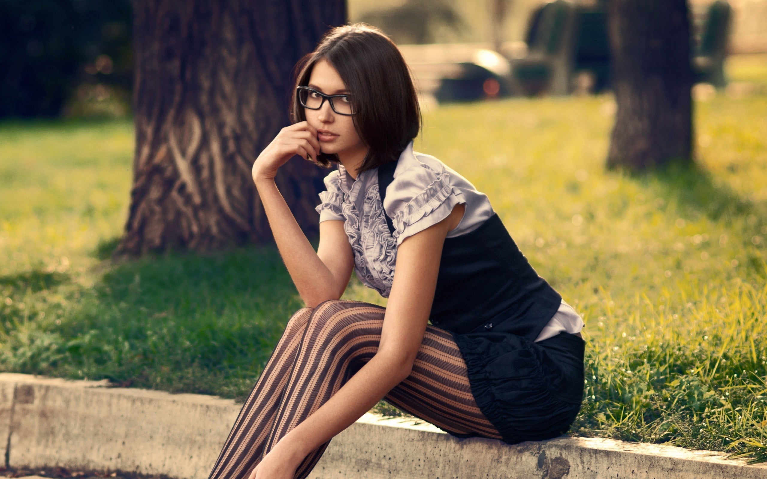 women's black framed eyeglasses, brunette, striped leggings, nerds