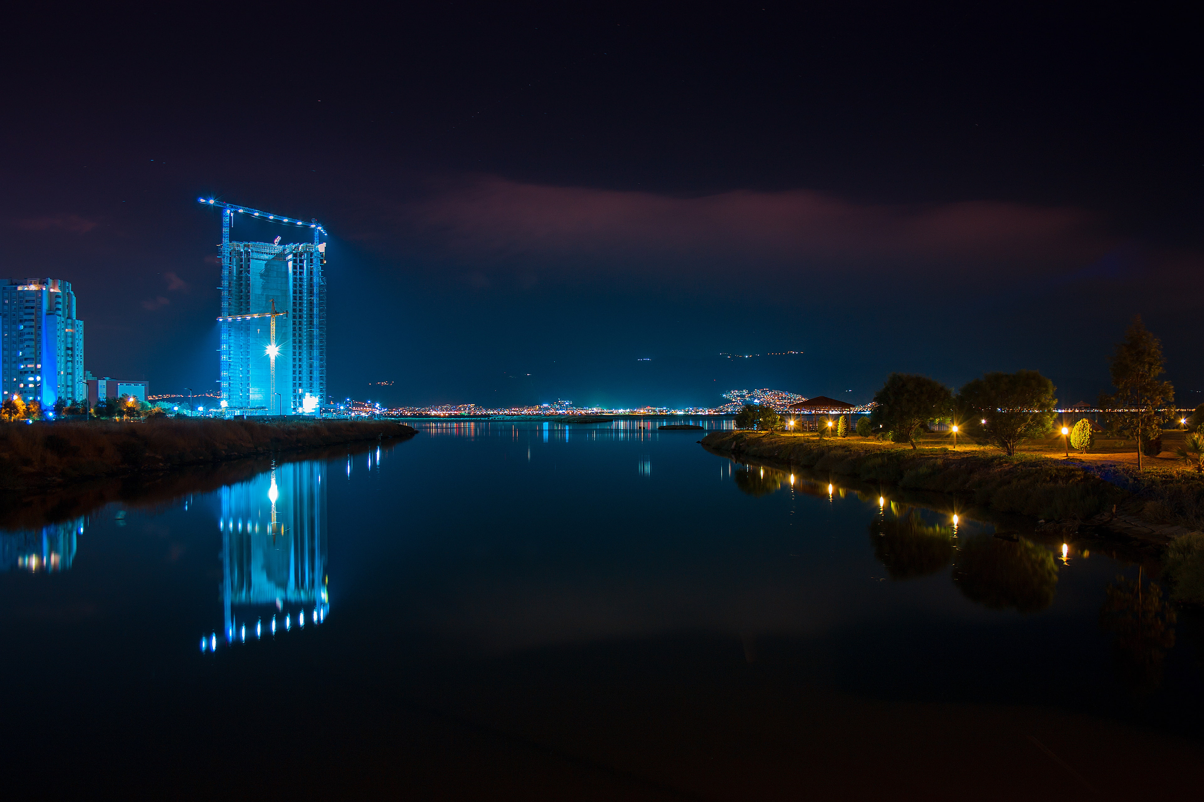 photo of body of water near lighted city during night time, İzmir