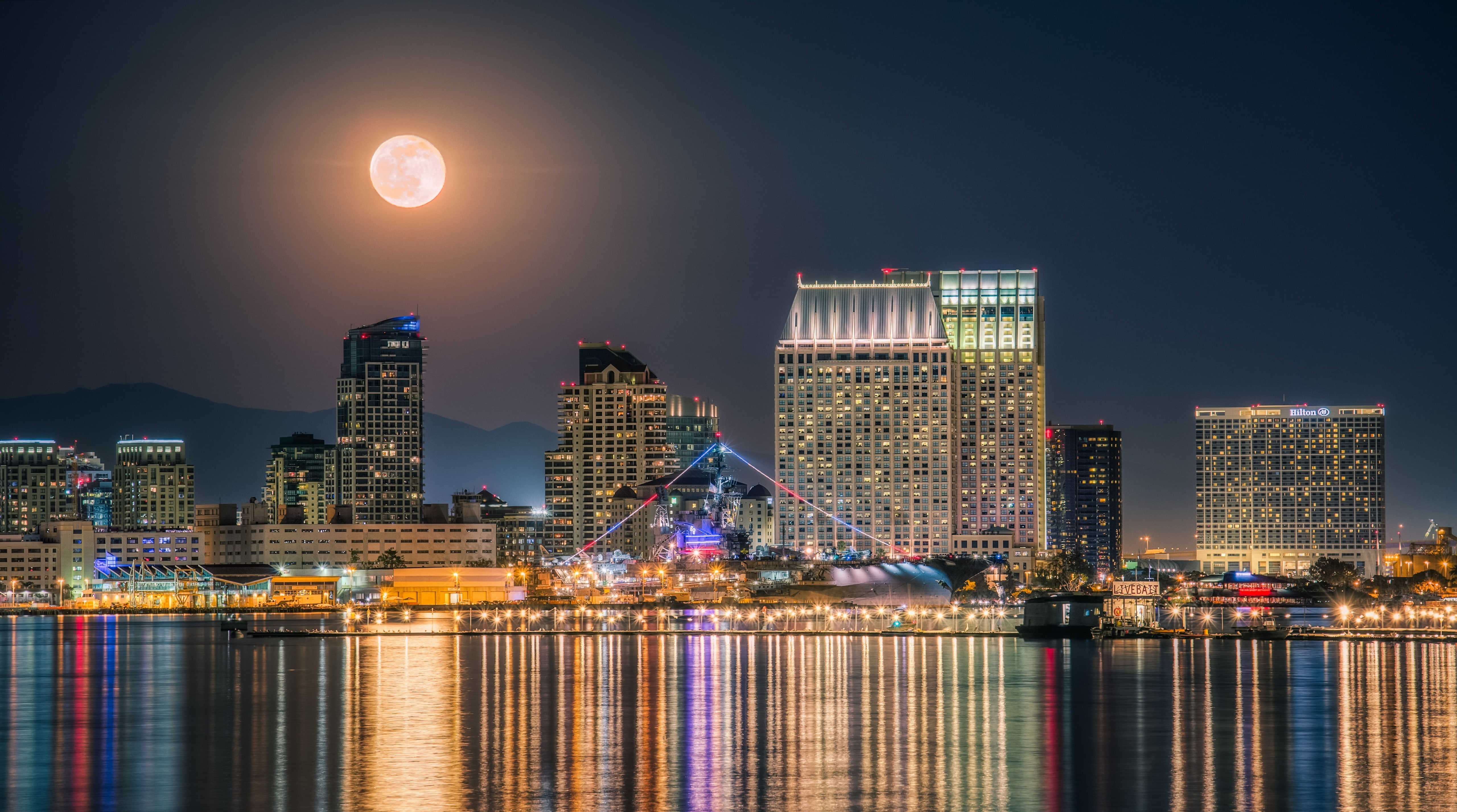 The Full Moon rising over the Downtown San..., gray concrete buildings