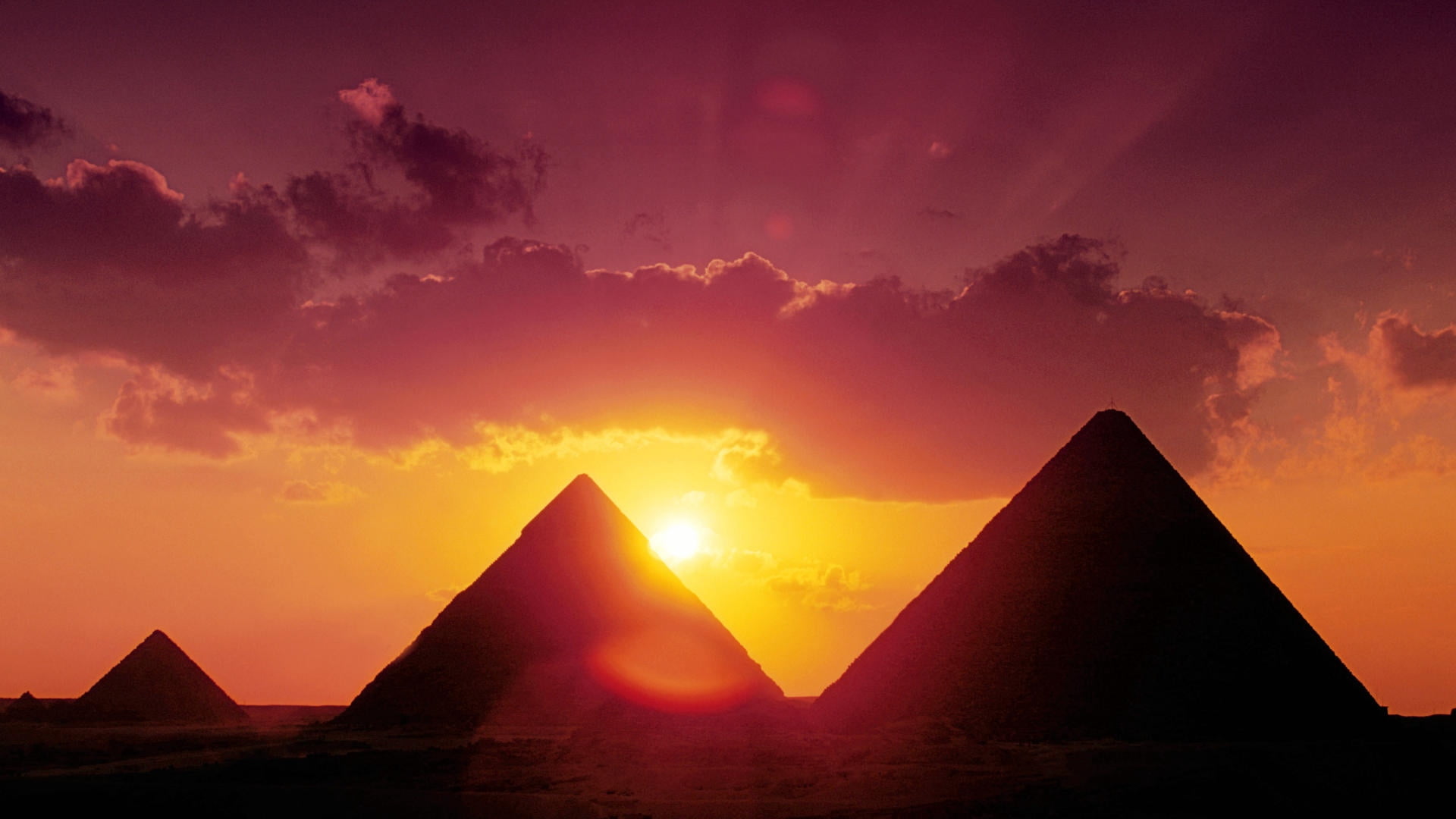 silhouette photo of three pyramids, lantern, park, trees, winter