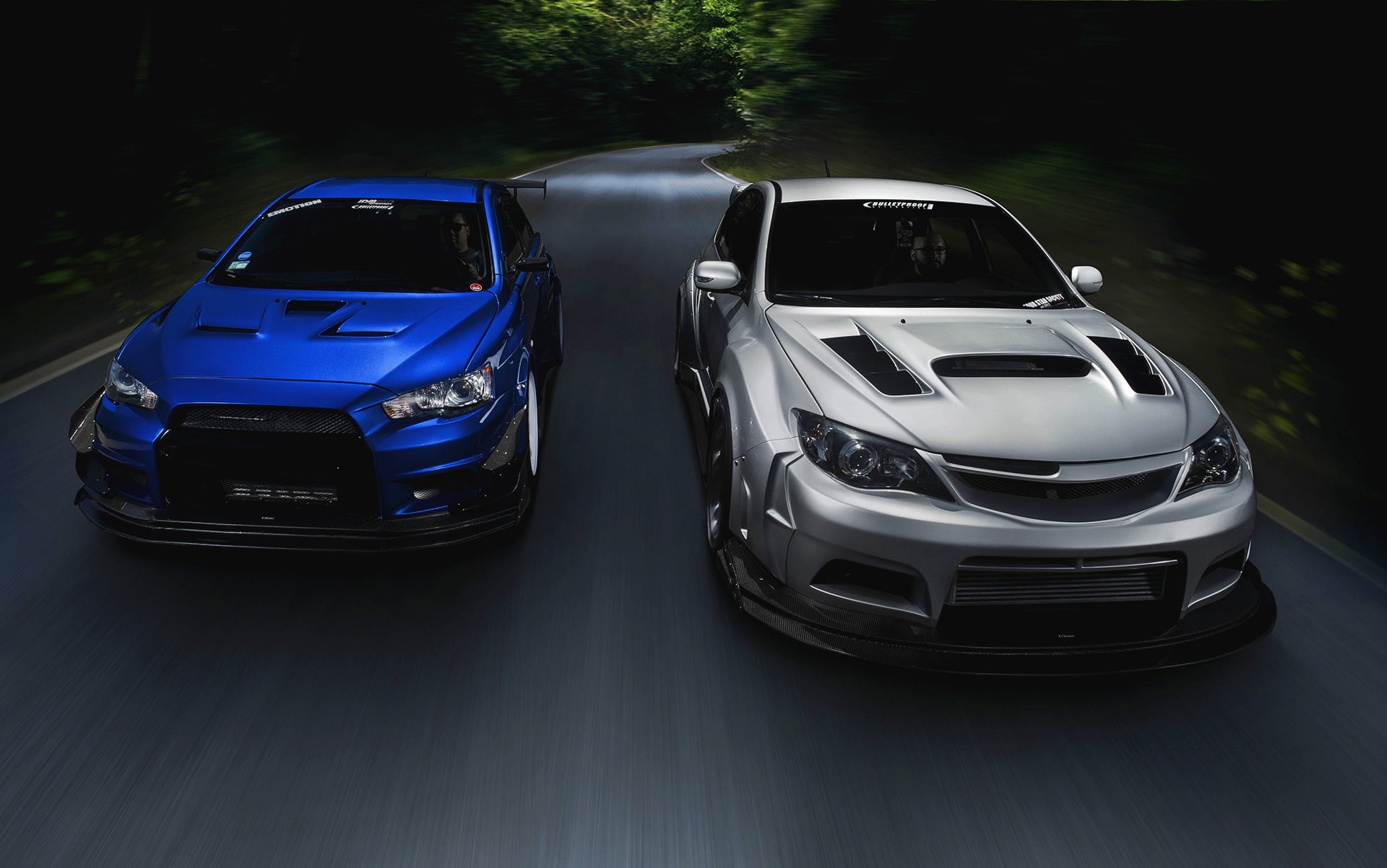 two silver-and-blue Subaru Impreza, Mitsubishi, Lancer, Evolution