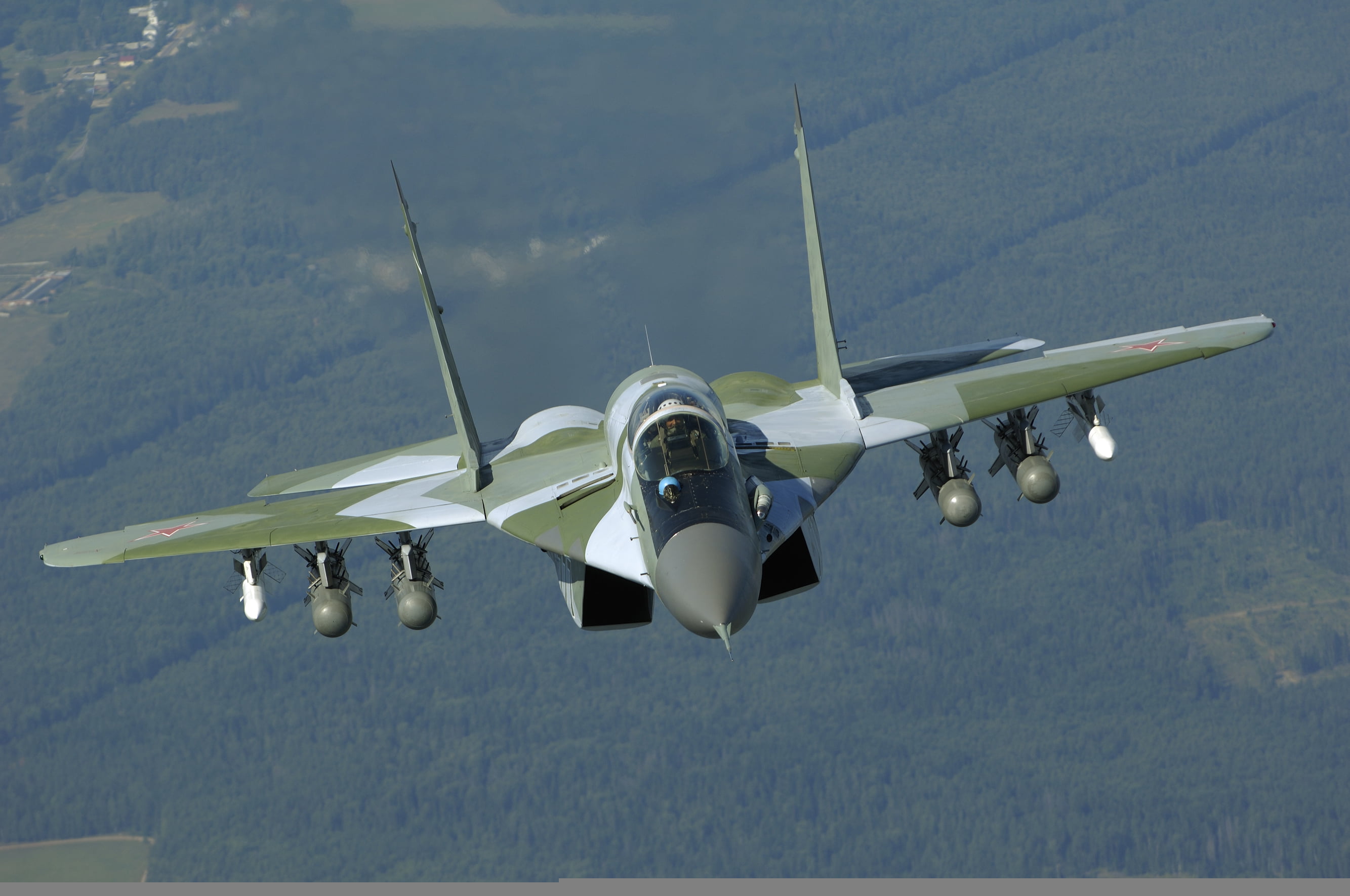 green and white fighter jet, flight, missiles, front view, bombs