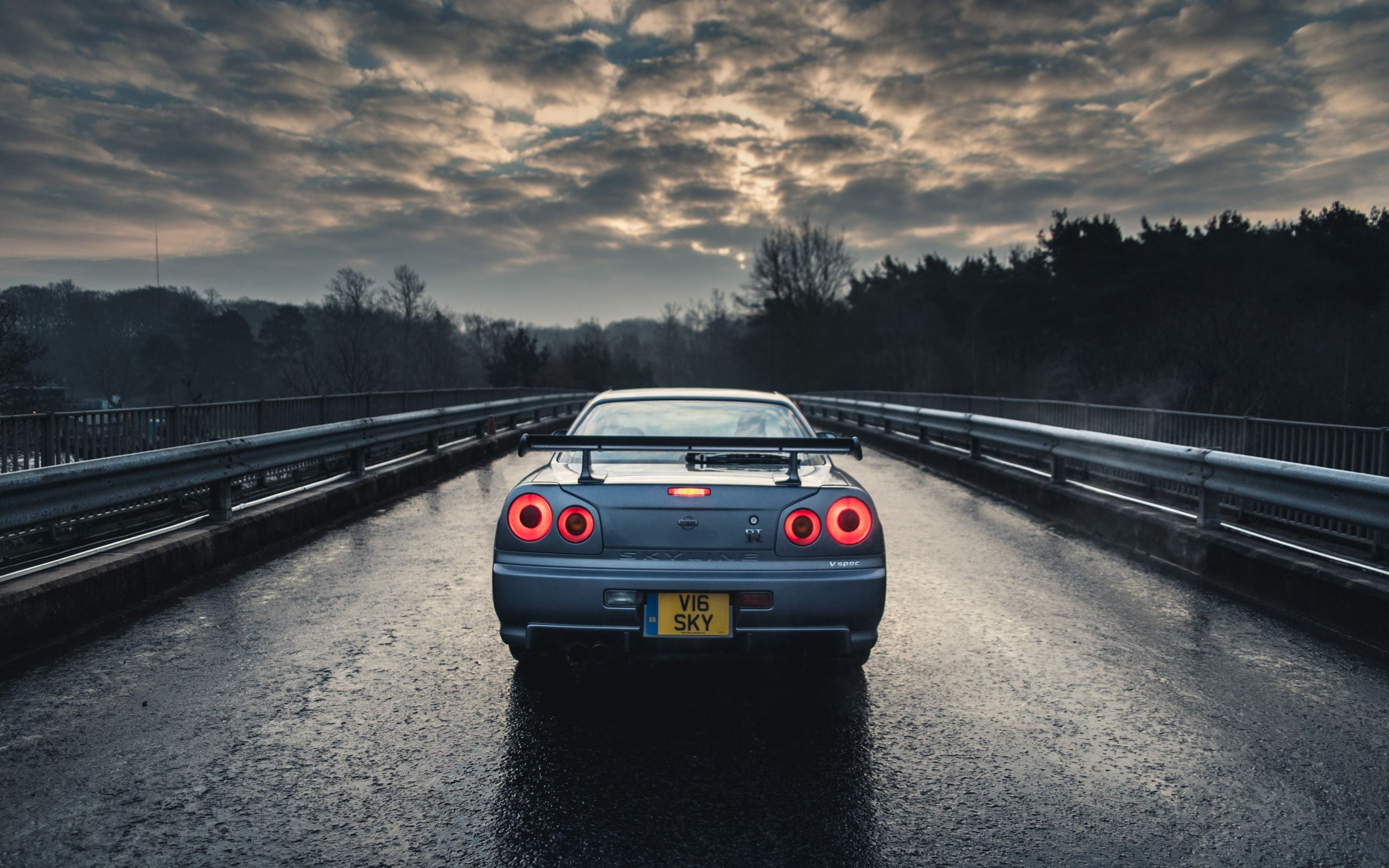 Free Download HD Wallpaper Blue Car Nissan Nissan Skyline GT R R Blue Cars Rain Trees