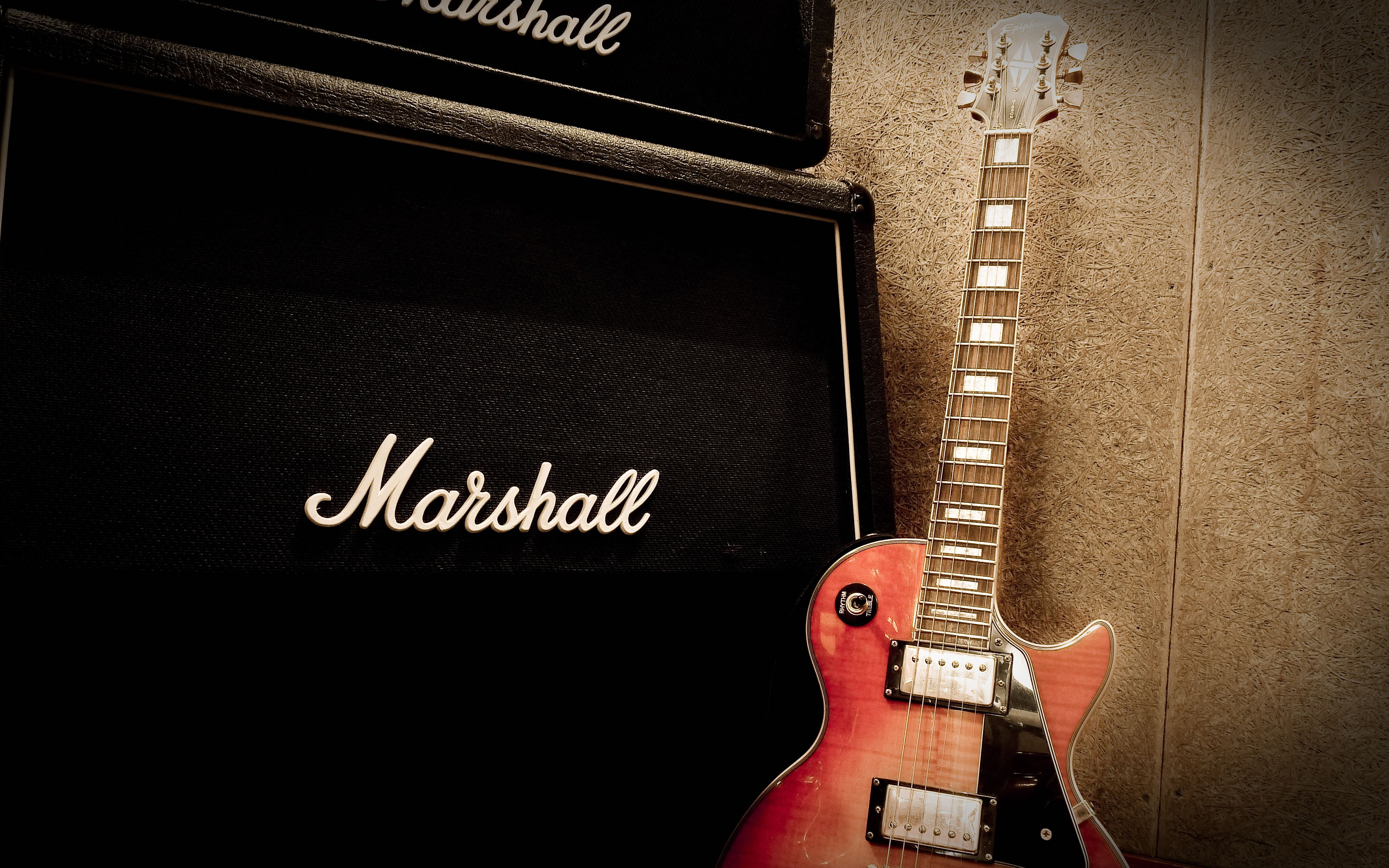 black Marshall guitar amplifier and red electric guitar, musical instrument